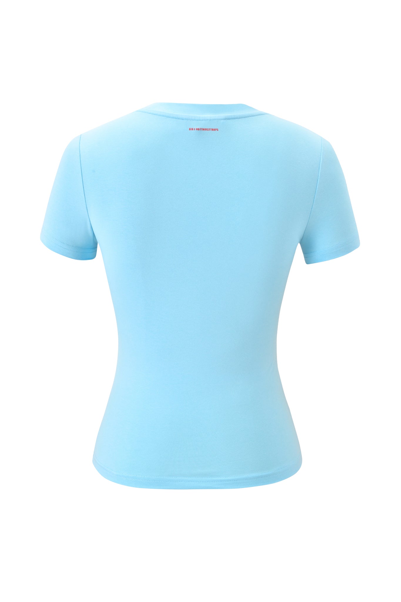 The I.AM.GIA POLINA TEE - TYPE is a fitted, light blue baby tee with short sleeves, shown from the back. It features a small red logo or text centered near the neckline and has no other visible designs.
