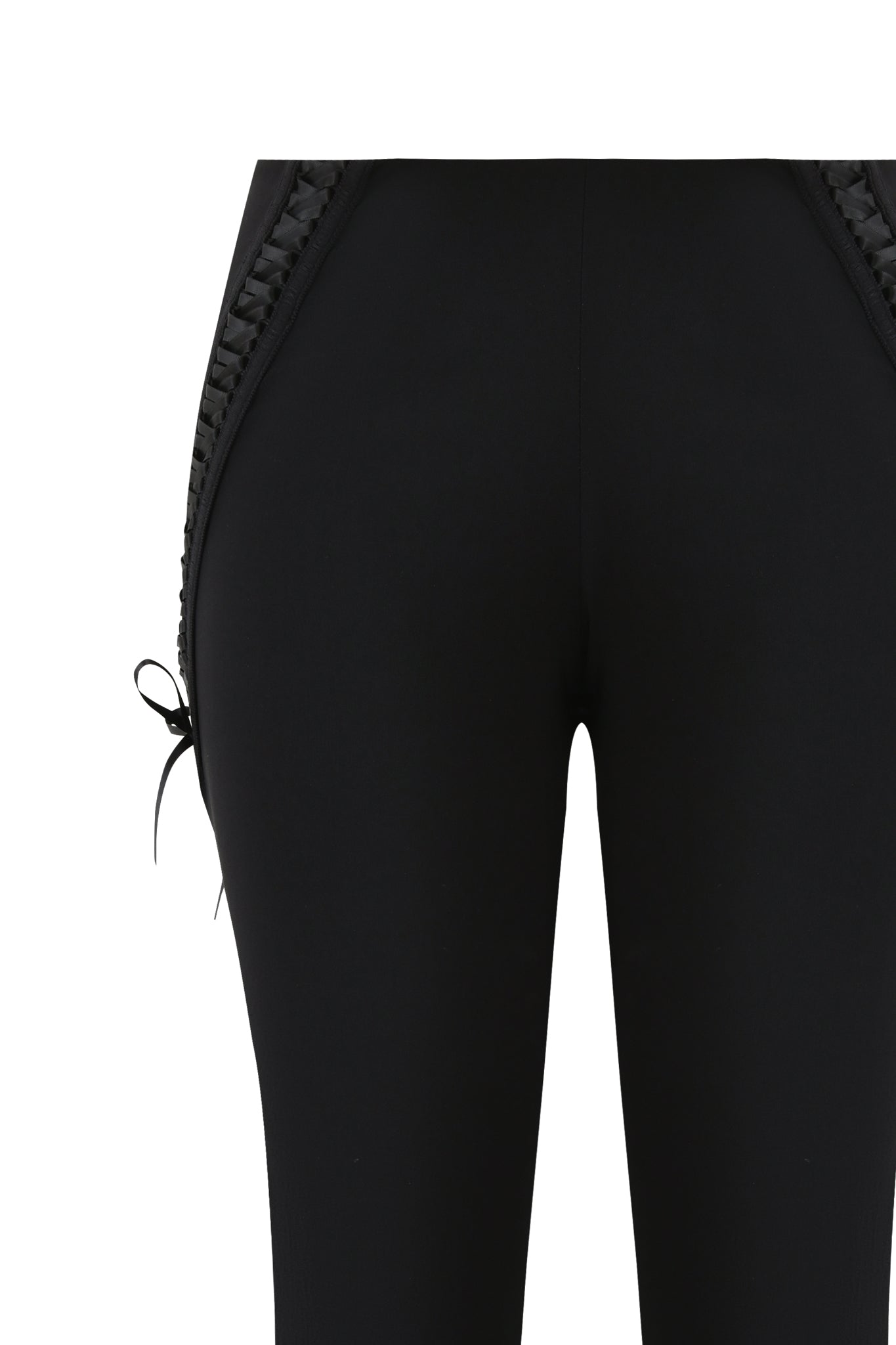 Close-up of the SAMIRA PANT - BLACK by I.AM.GIA, showcasing black flared pants with decorative braided side trim, a small bow detail on the left, and a fashionable low-rise waist.