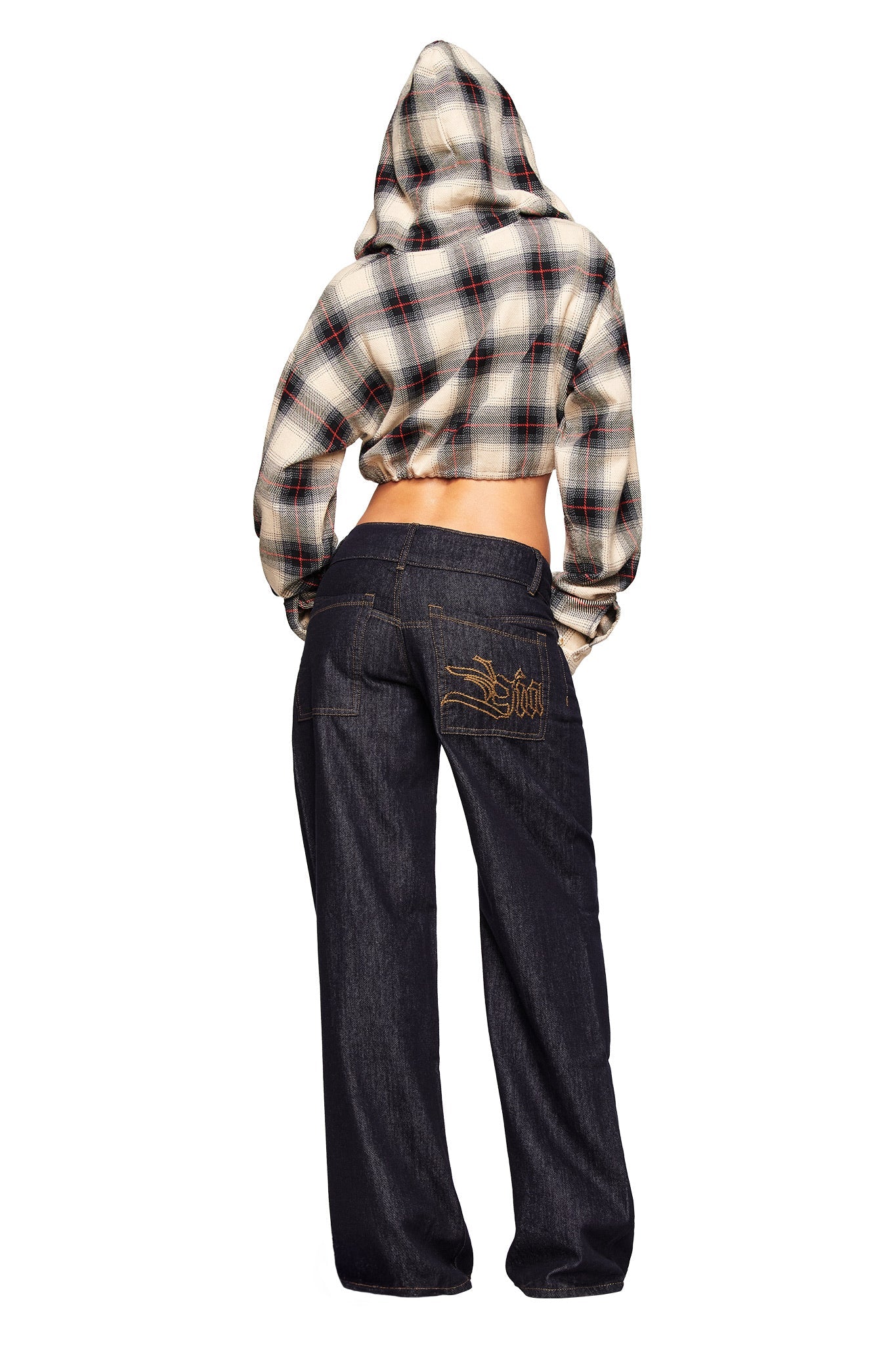 A person stands with their back to the camera, wearing the I.AM.GIA TIFF JACKET in grey plaid and loose-fitting dark jeans featuring gold embroidery on the back pocket.