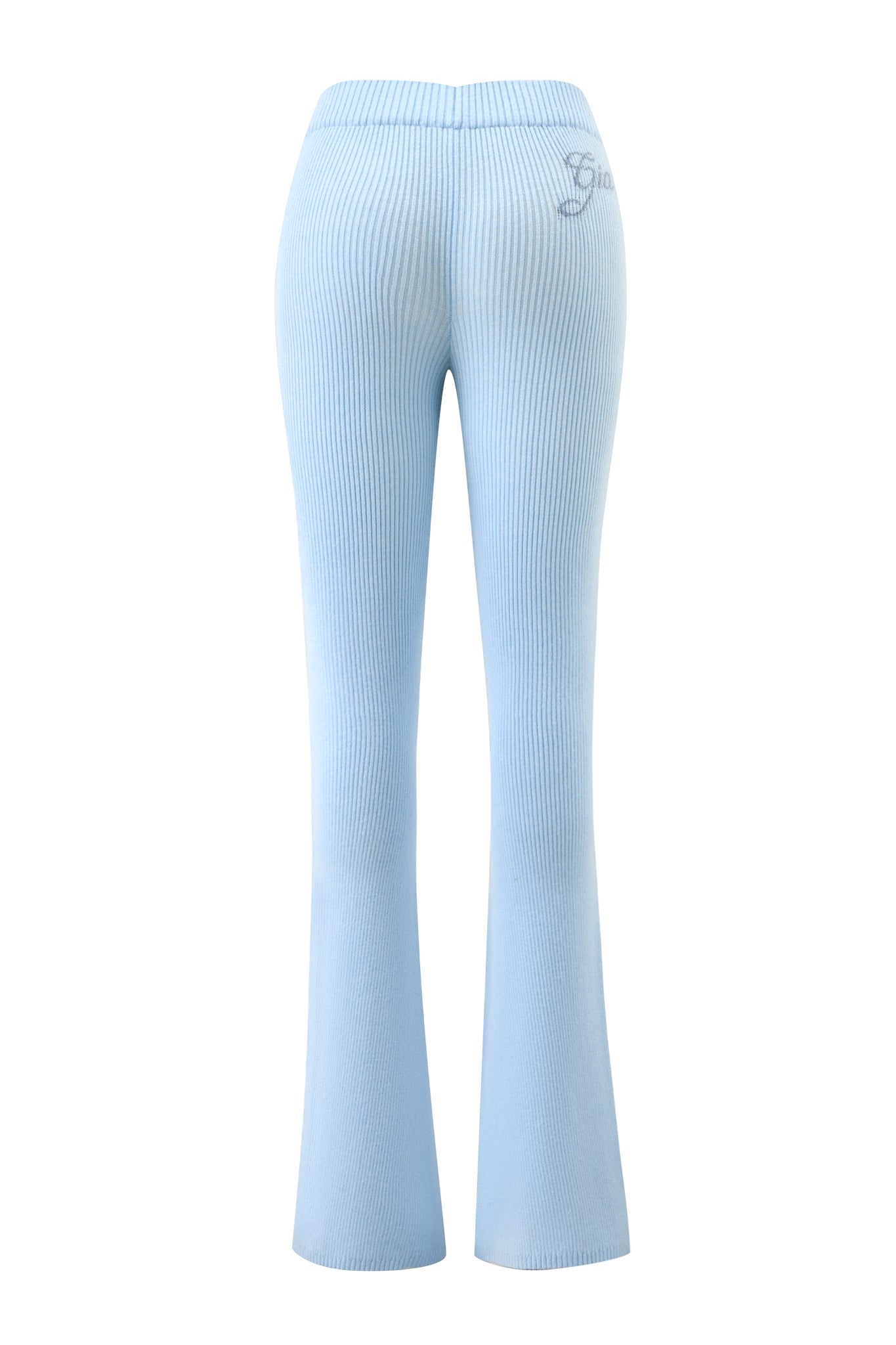 The BLARE KNIT TRACKPANT - BLUE by I.AM.GIA features a ribbed finish, elastic waistband, small logo on the upper right hip, and a stylish flared leg silhouette, shown here from the back.