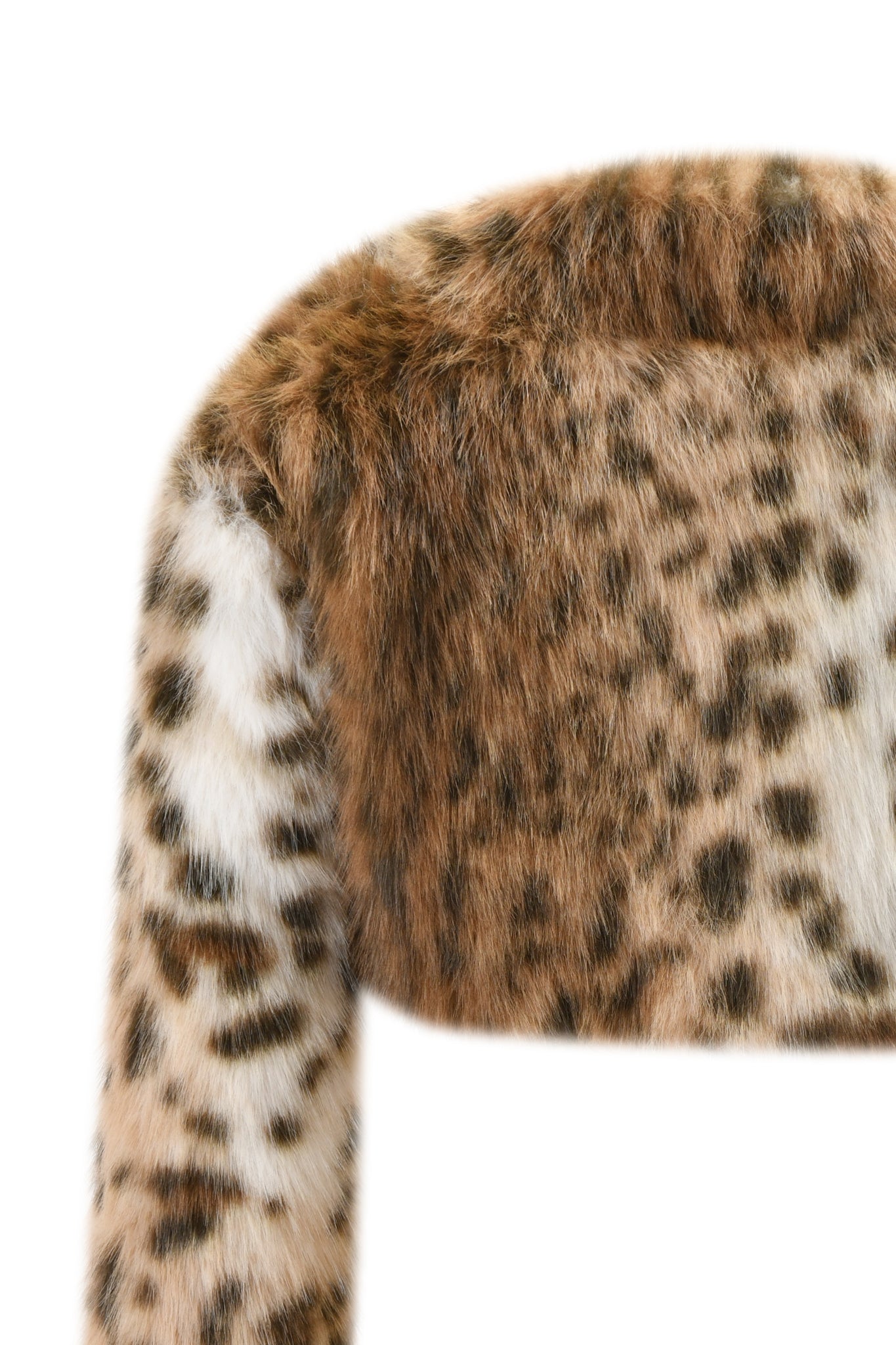 A close-up of the I.AM.GIA ALBA BOLERO - LEOPARD, a faux fur cropped jacket with a brown, black, and white leopard print, highlights its textured and detailed spotted design.