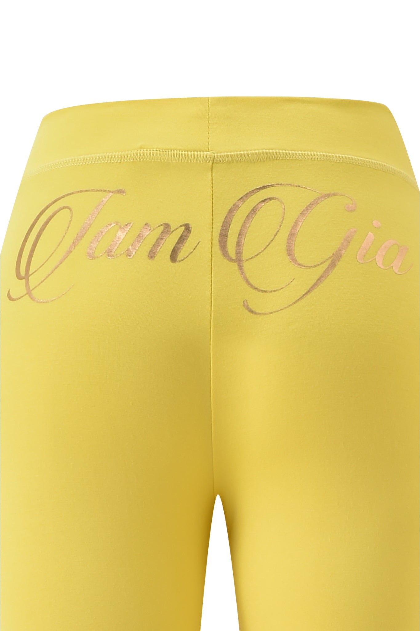Close-up of the yellow BLARE FORM POCKET TRACKPANT by I.AM.GIA, featuring "I.AM.GIA" in metallic gold foil cursive on the waistband and crafted from sculpted Form fabric for a sleek look.