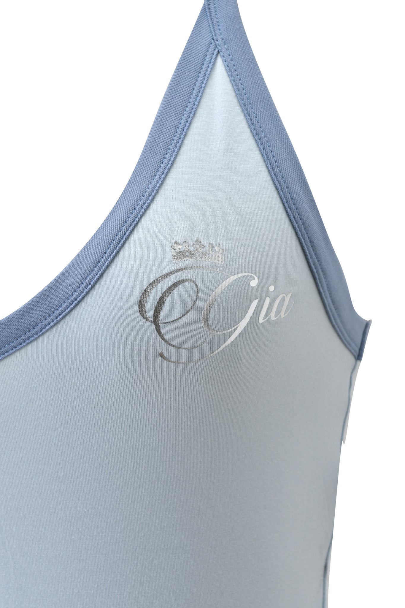 Close-up of the I.AM.GIA BLARE V-NECK TANK in two-tone powder blue, body-hugging with "Gia" and a small silver crown graphic on the front.