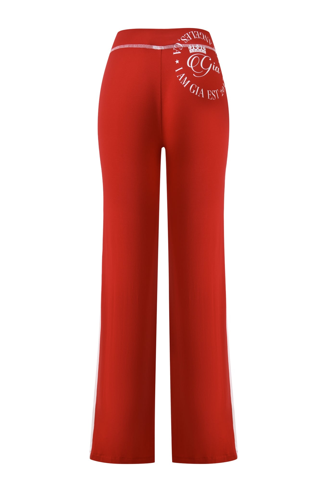 Rear view of the I.AM.GIA BLARE BAMBOO PANELLED TRACKPANT in red, featuring a white logo and text on the upper left back, shiny waistband, straight leg silhouette, and smooth bamboo fabric for comfort.