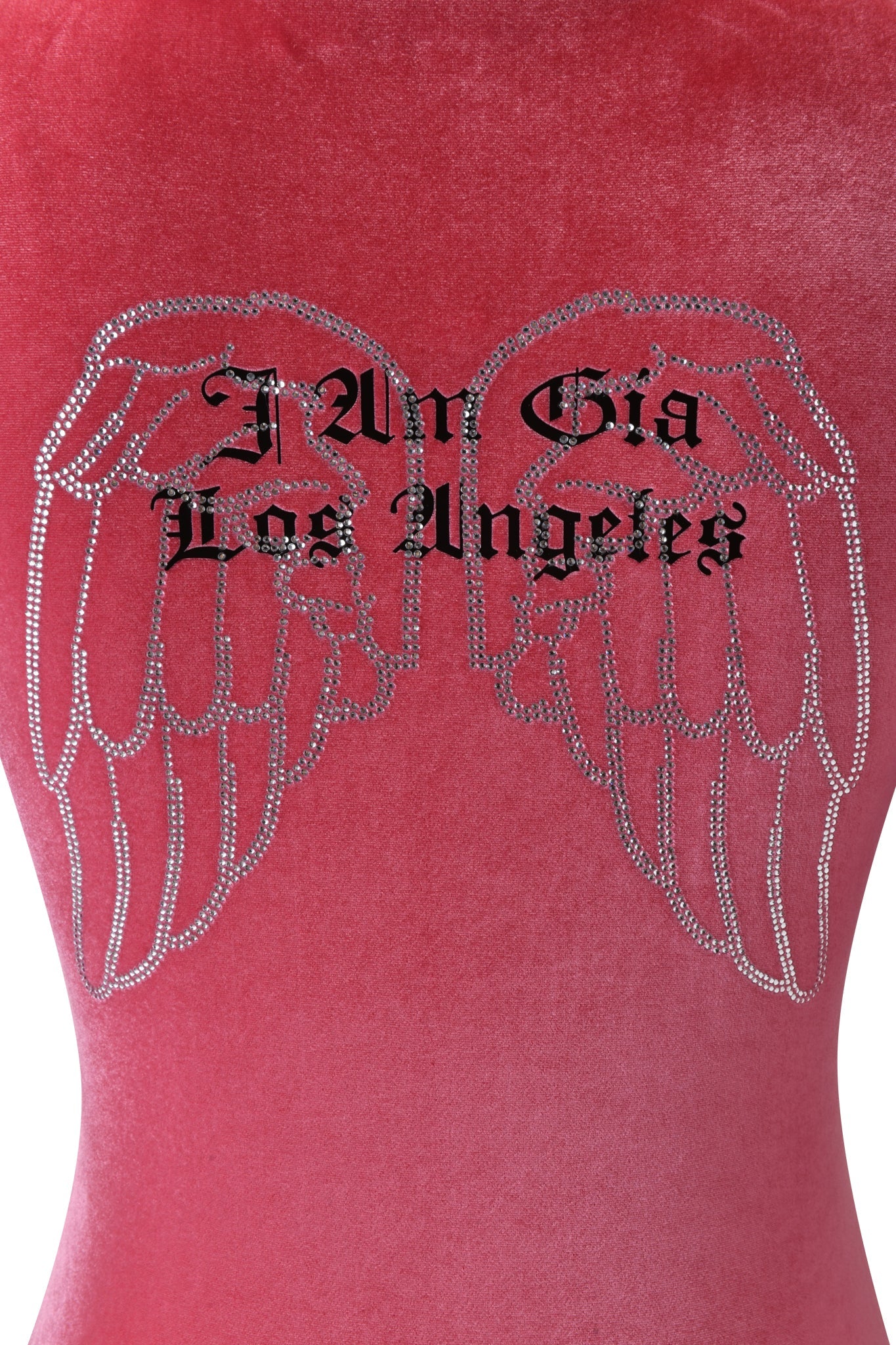 A close-up of the I.AM.GIA BLARE VELOUR POCKET HOODIE in pink, showcasing diamanté angel wings and "I.AM.GIA Los Angeles" in black Gothic font on the back.