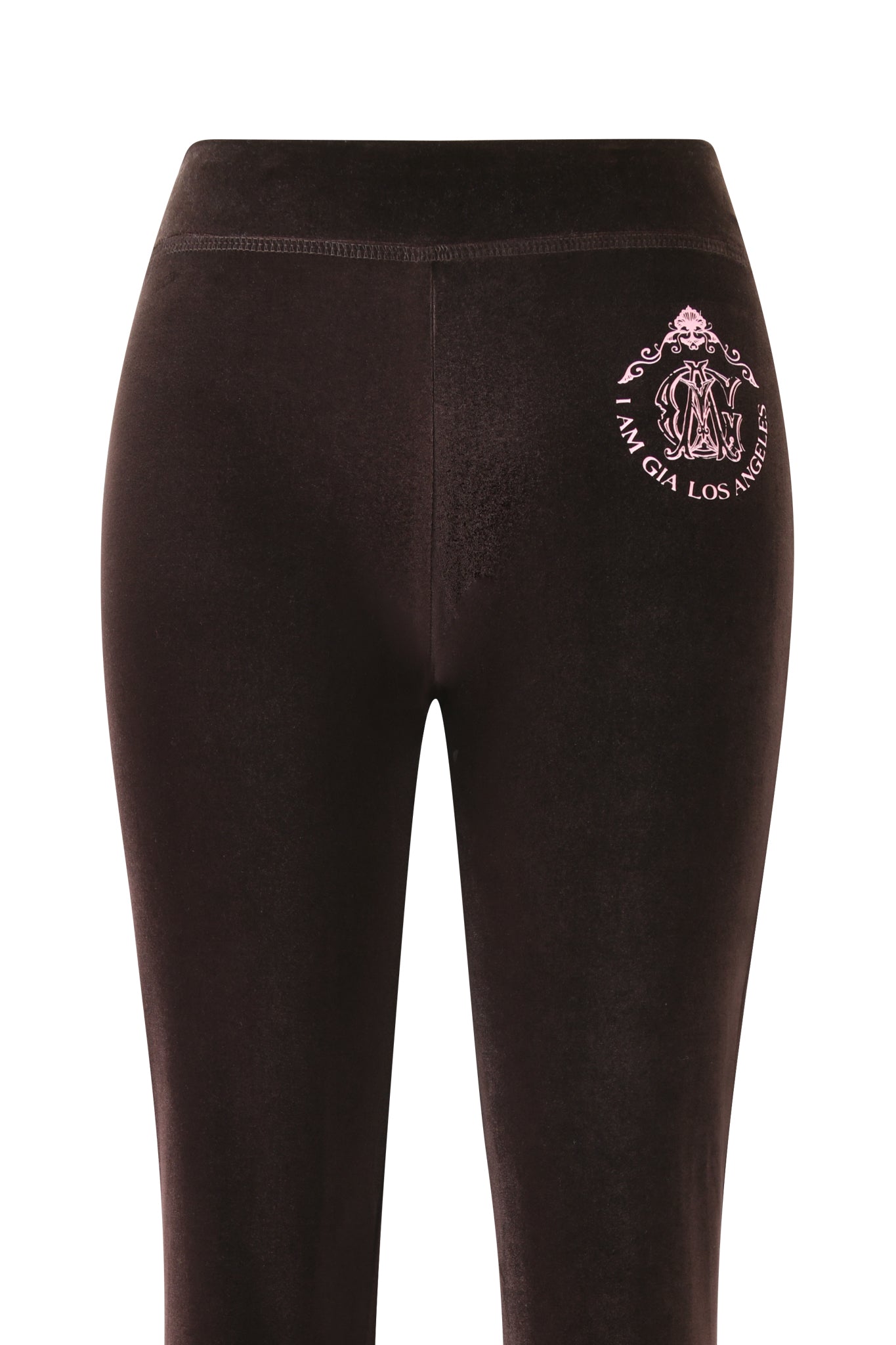 The image shows the back view of the I.AM.GIA BLARE VELOUR POCKET TRACKPANT in chocolate velour, with a high waist and signature detailing, reminiscent of the brand's classic style.