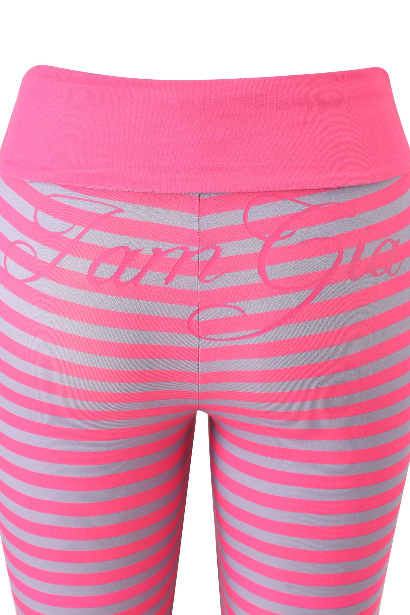 Close-up of I.AM.GIA BLARE FOLDOVER TRACKPANT - HOT PINK STRIPE, featuring pink and gray stripes, a wide hot pink waistband, and "I.AM.GIA" in cursive across the upper part for a stylish, trendy look.