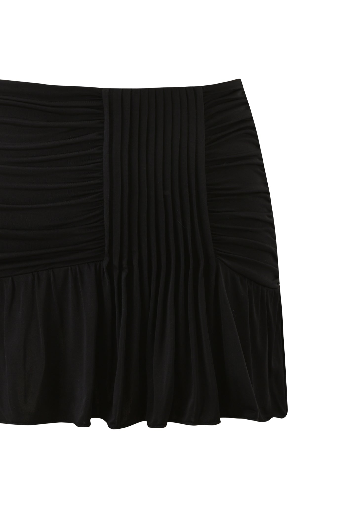 The ELYSIA MINI SKIRT - BLACK by I.AM.GIA is a high-stretch, slinky knit mini skirt featuring side ruching, vertical center pleats, and a subtly flared hem. Shown against a white background.