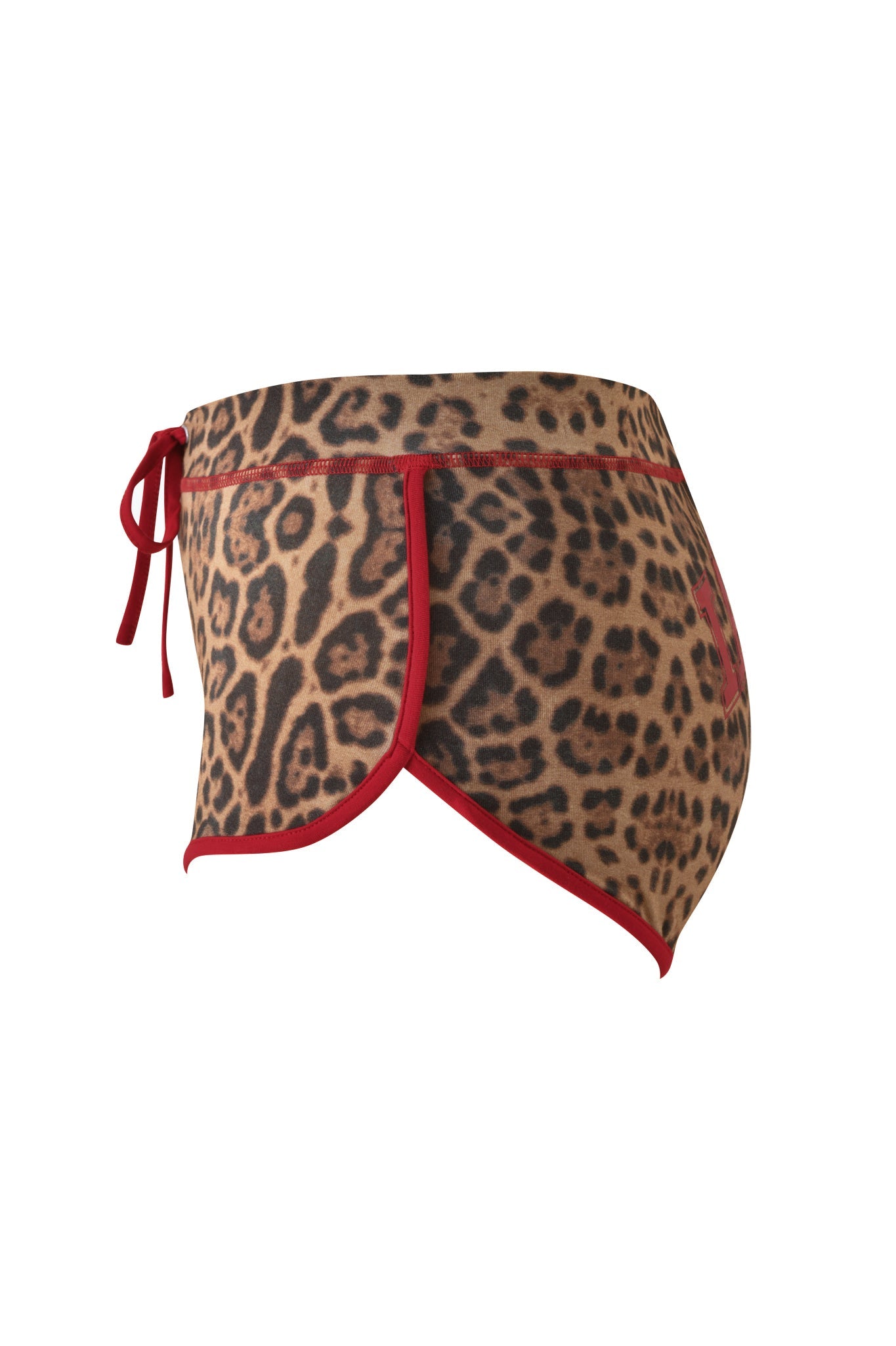 Side view of the I.AM.GIA BLARE DOLPHIN SHORT - PANTHERA, featuring a leopard print design with red trim and a left-side tie, crafted from soft bamboo fabrication for a comfortable fit—ideal for summer adventures, isolated on a white background.