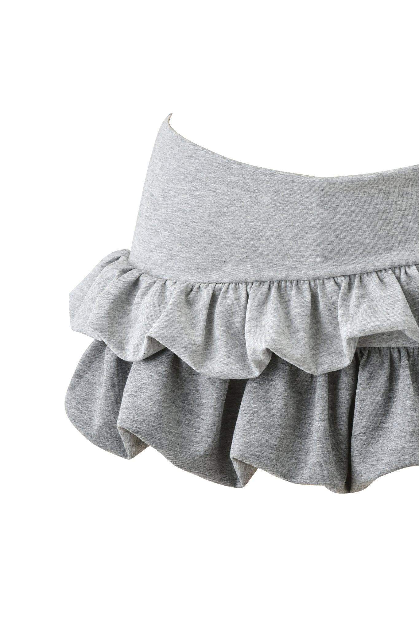 The CHERRI MINI SKIRT - GREY MULTI by I.AM.GIA is a light gray, two-tier skirt with an elastic waistband and ruffled layers of soft, gathered fabric, shown against a white background.