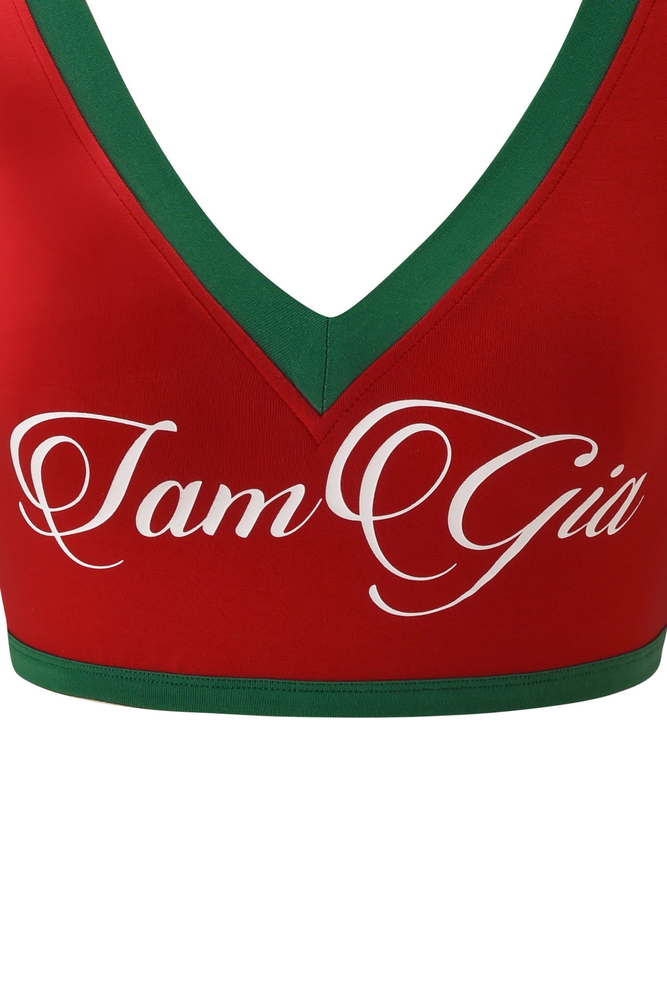 The I.AM.GIA BLARE SPORT CROP TEE AND HEADBAND - CRIMSON features a red crop top with green trim and "I am Gia" in white cursive, perfect for adding a bold touch to your outfit.
