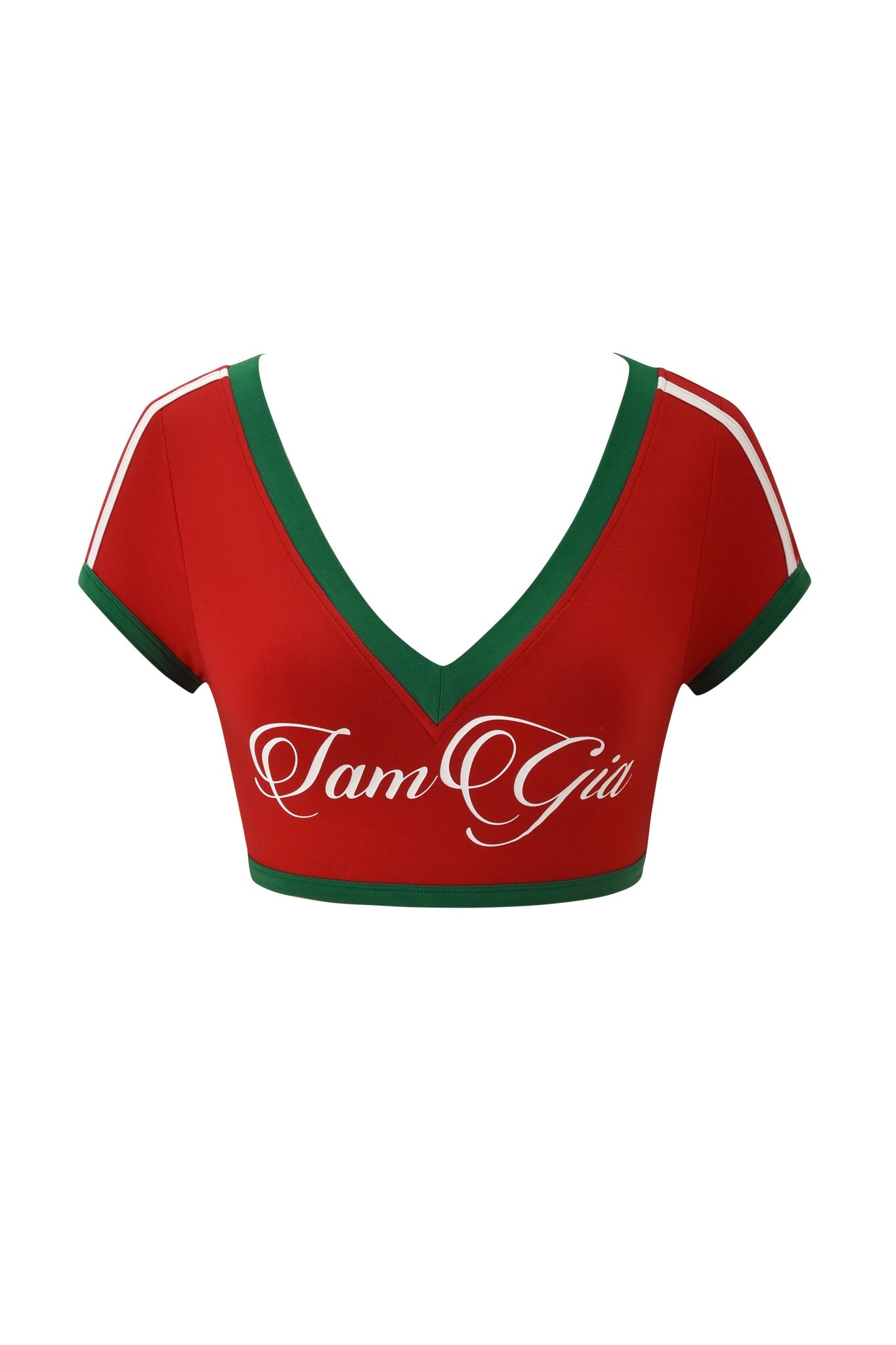 The BLARE SPORT CROP TEE AND HEADBAND - CRIMSON by I.AM.GIA is a red crop top featuring a V-neck, green trim, and white shoulder stripes, with "I am Gia" in white cursive on the front for a bold, stylish look.