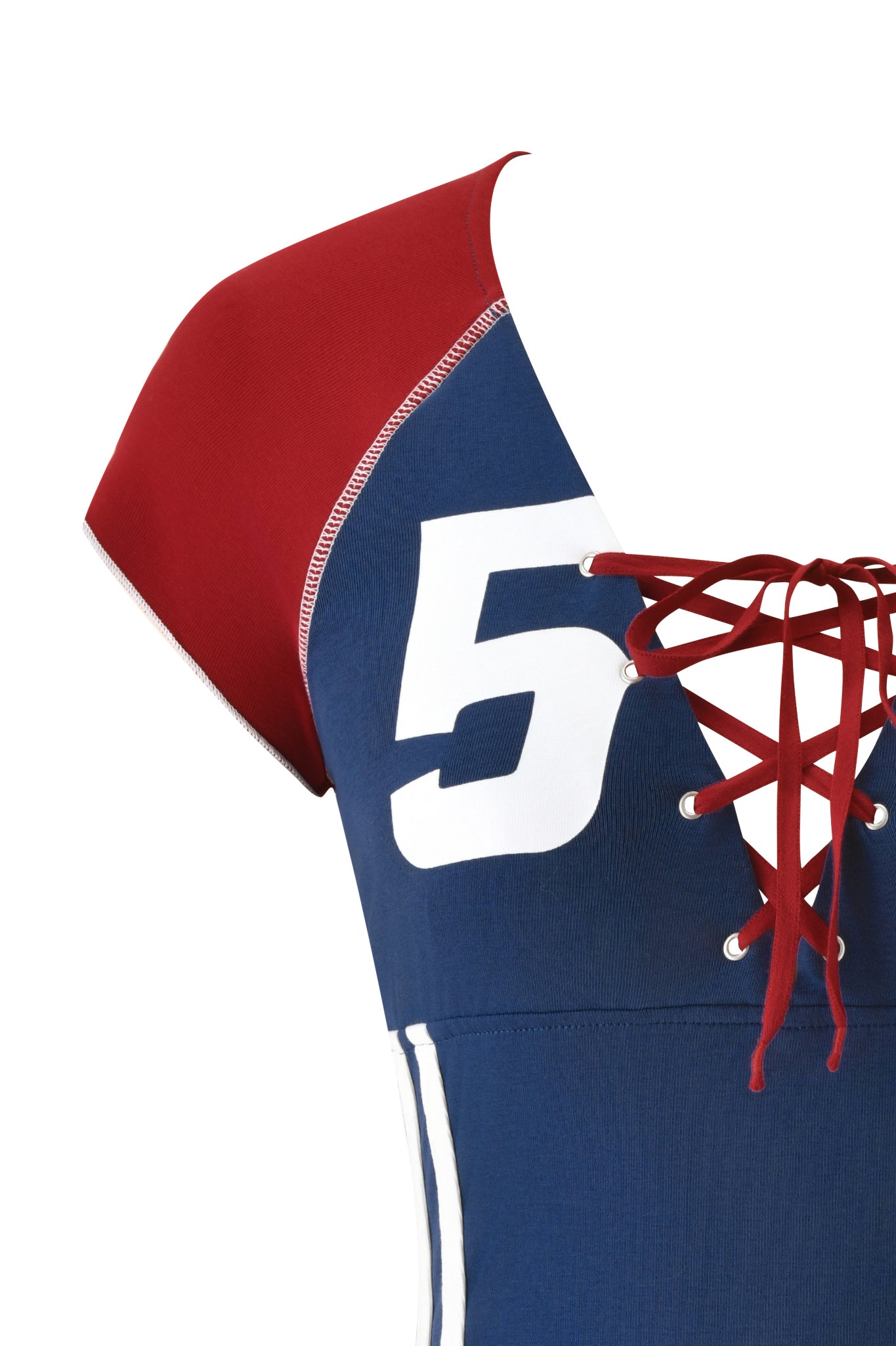 Close-up of the NOVIA LACE-UP T-SHIRT AND HEADBAND in navy by I.AM.GIA, a stretch cotton crop top featuring a white number 5, red lace-up front, and red shoulder section, styled like a soccer jersey baby tee.