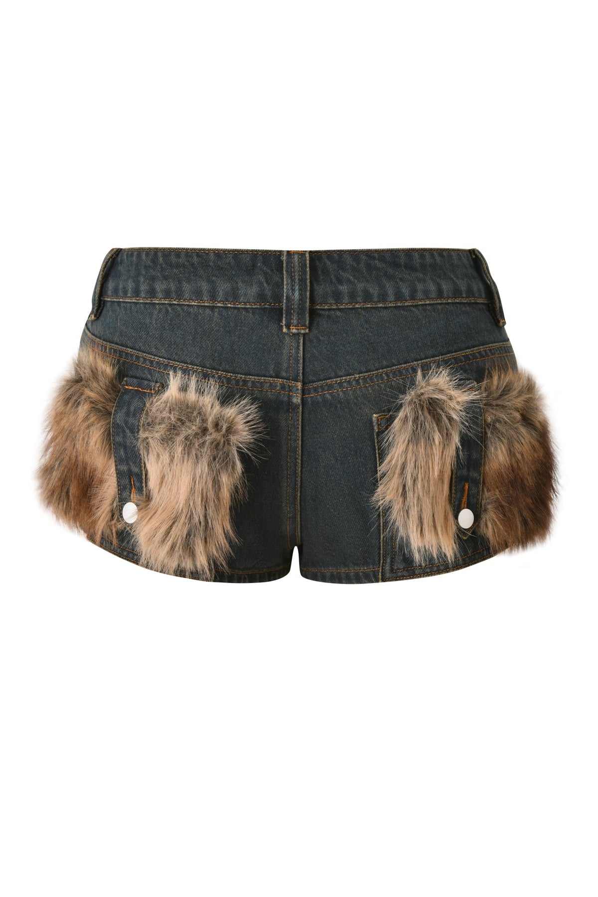 The I.AM.GIA BODI DENIM HOT SHORT - DENIM features a dark micro denim construction with belt loops, large brown and tan faux fur patches on the back pockets, bold button accents, and visible contrast stitching. Styled with faux fur trim, these statement shorts are showcased against a white background—ideal for turning heads at any festival party.