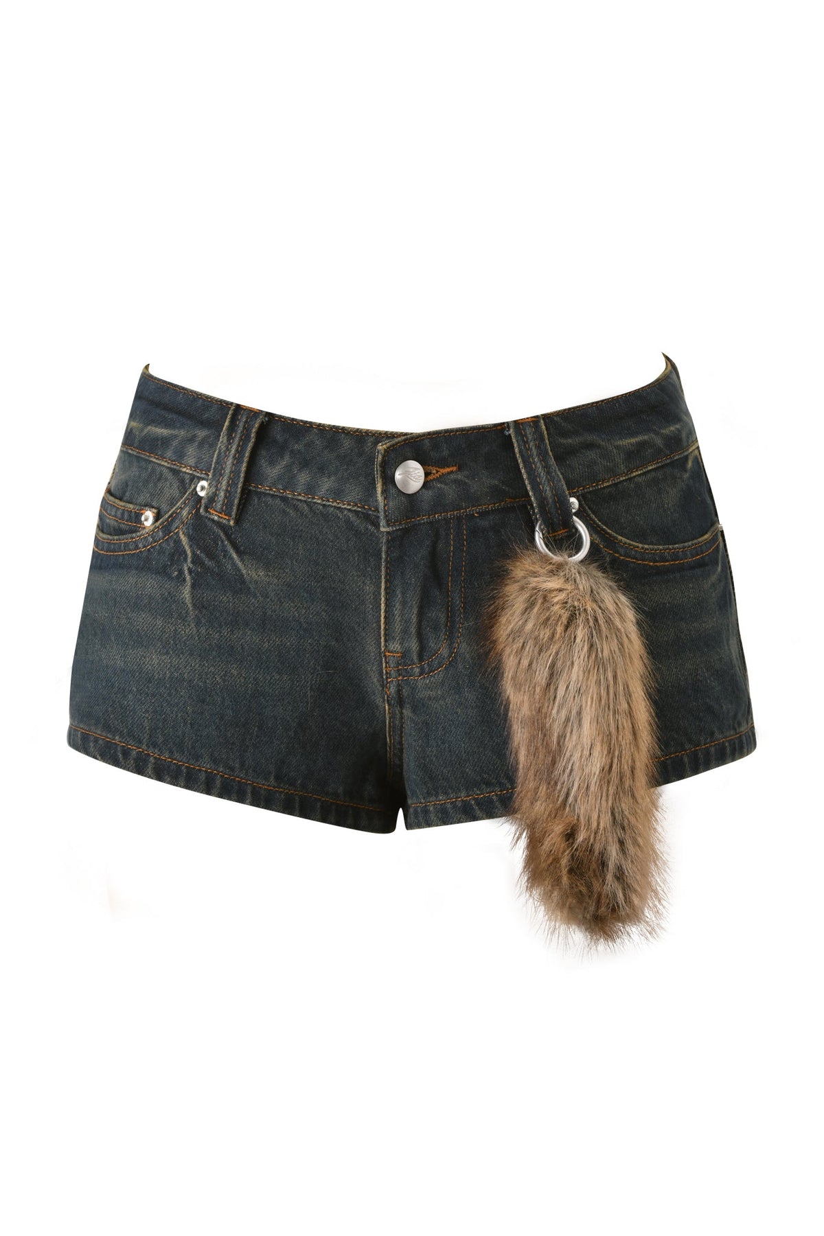 The I.AM.GIA BODI DENIM HOT SHORT - DENIM is a pair of dark micro denim festival party shorts, featuring a furry brown and gray tail accessory attached to the right belt loop. Displayed against a white background.
