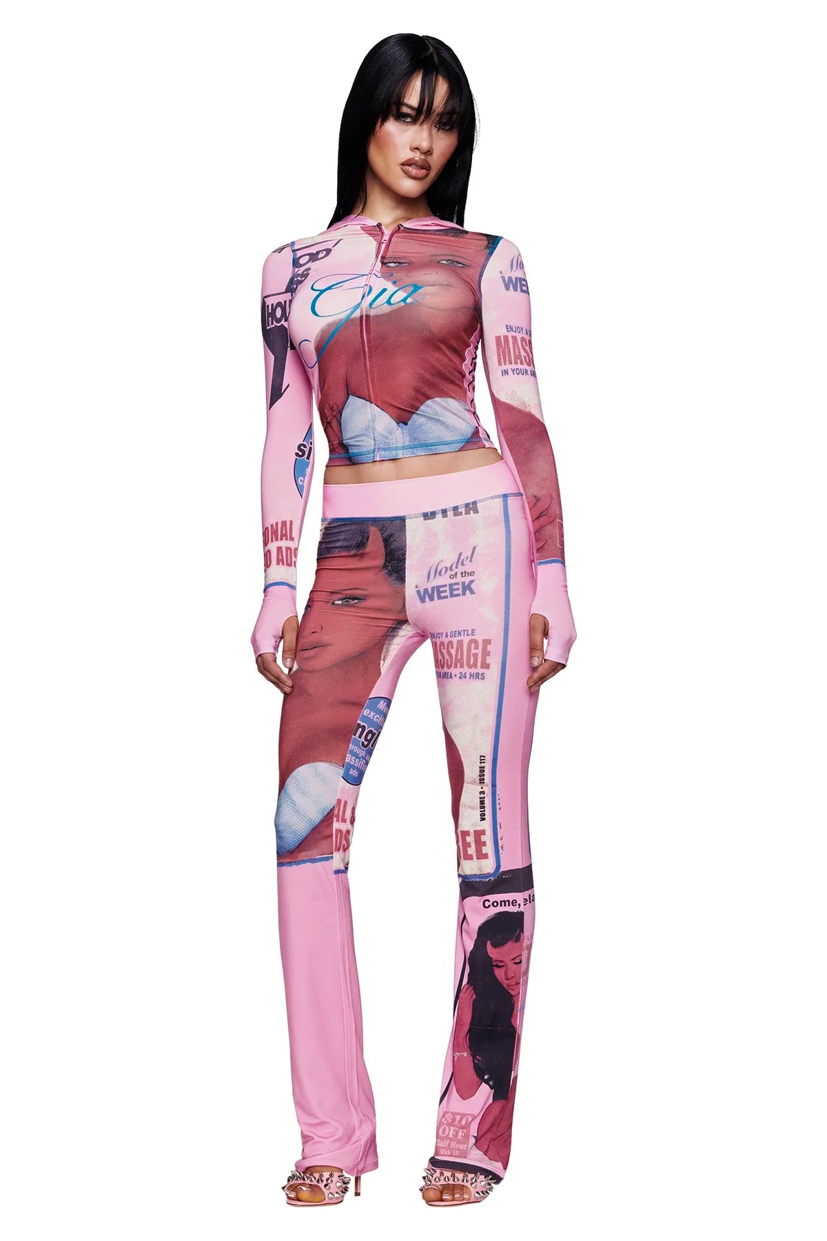 A woman faces forward, wearing the I.AM.GIA T-REX BLARE HOODIE in pink paired with open-toe heels.