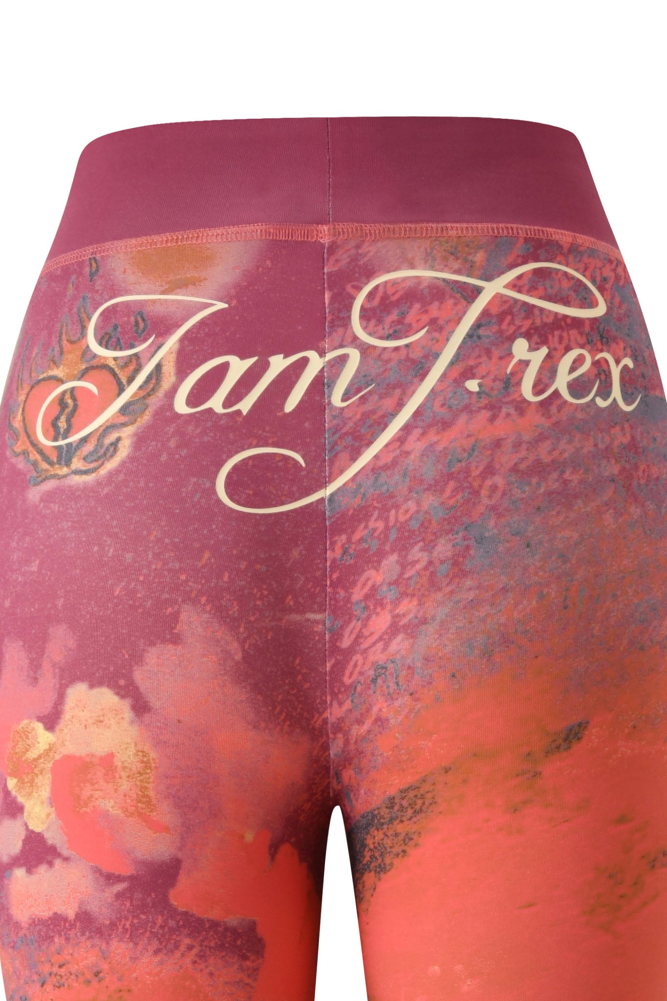 Close-up of the back of the I.AM.GIA T-REX BLARE TRACKPANT - RED, featuring a pink, orange, and T-REX red abstract print pattern with the cursive "Jam T. rex" text across the waistband, echoing the signature style of the Blare Trackpant collection.