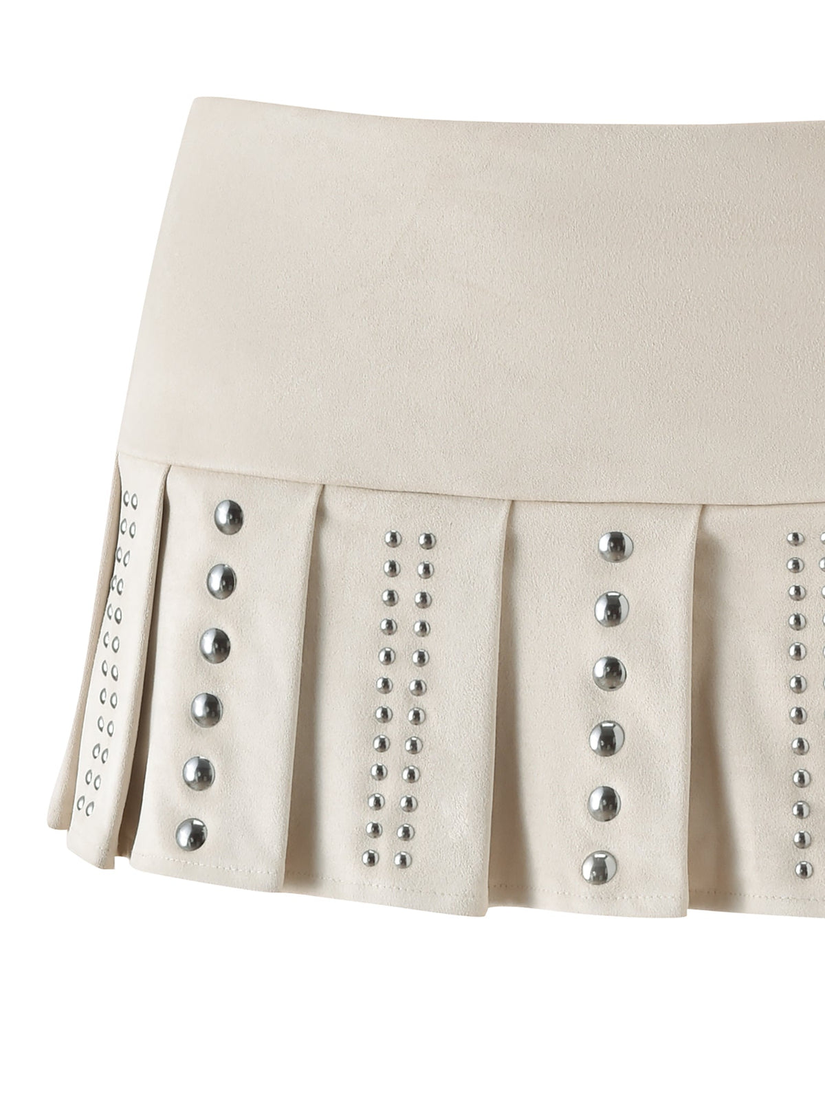 The VEYGA STUDDED MINI SKORT by I.AM.GIA is a cream faux suede skort crafted in a low-rise mini silhouette, featuring a pleated skirt overlay with vertical pleats and rows of silver studs accenting each pleat.