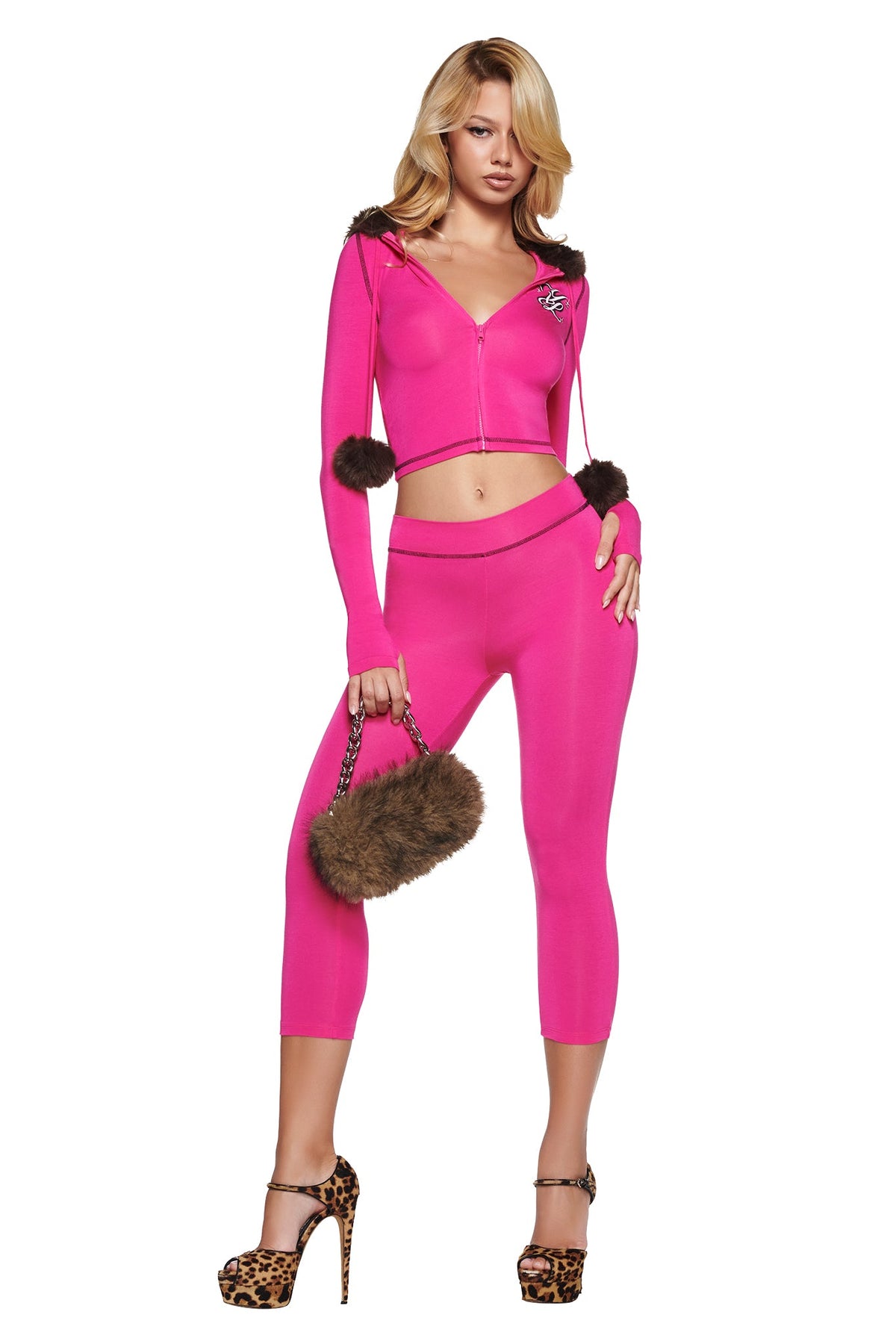 A person wears a hot pink YVL BLARE FUR LINED HOODIE - PINK with a cropped zip-up design and matching leggings, styled with leopard print high-heeled sandals and a matching faux fur handbag.