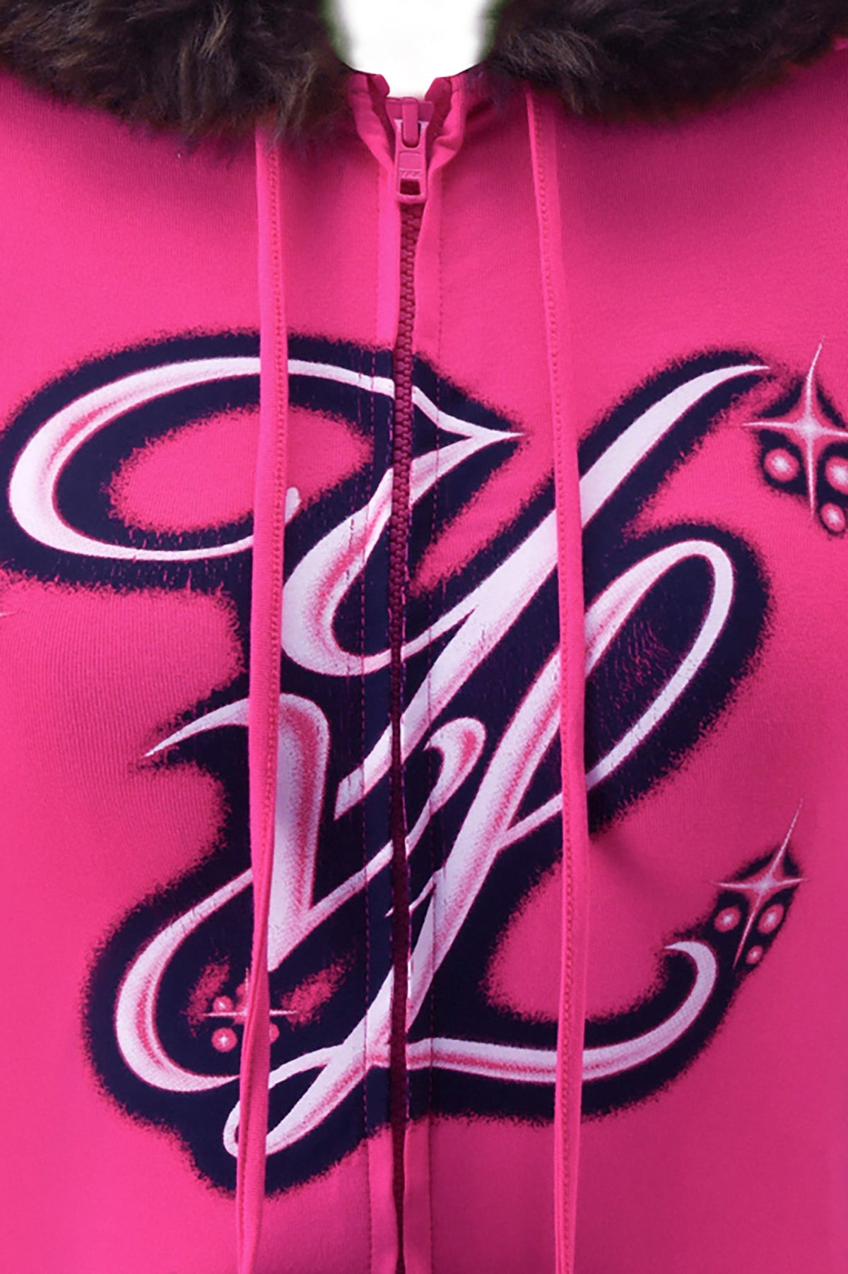 Bright pink I.AM.GIA YVL BLARE FUR LINED CAP SLEEVE HOODIE featuring a faux fur-trimmed hood and stylized “YVL” lettering in dark blue and white.