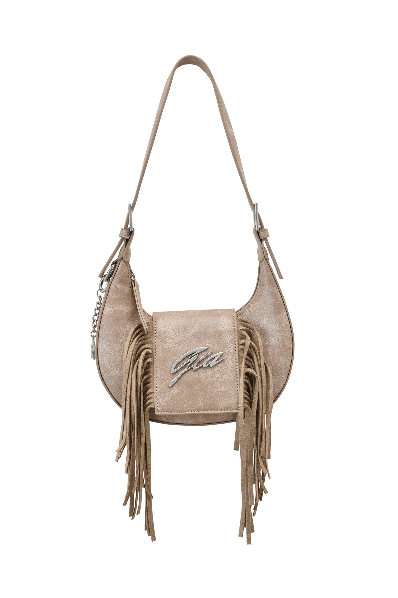 The TIA BAG - TAN FRINGE by I.AM.GIA is a tan faux leather shoulder purse with a flap closure, silver "Gia" logo, decorative keychain, long side fringe detailing, and an adjustable strap for versatile wear.