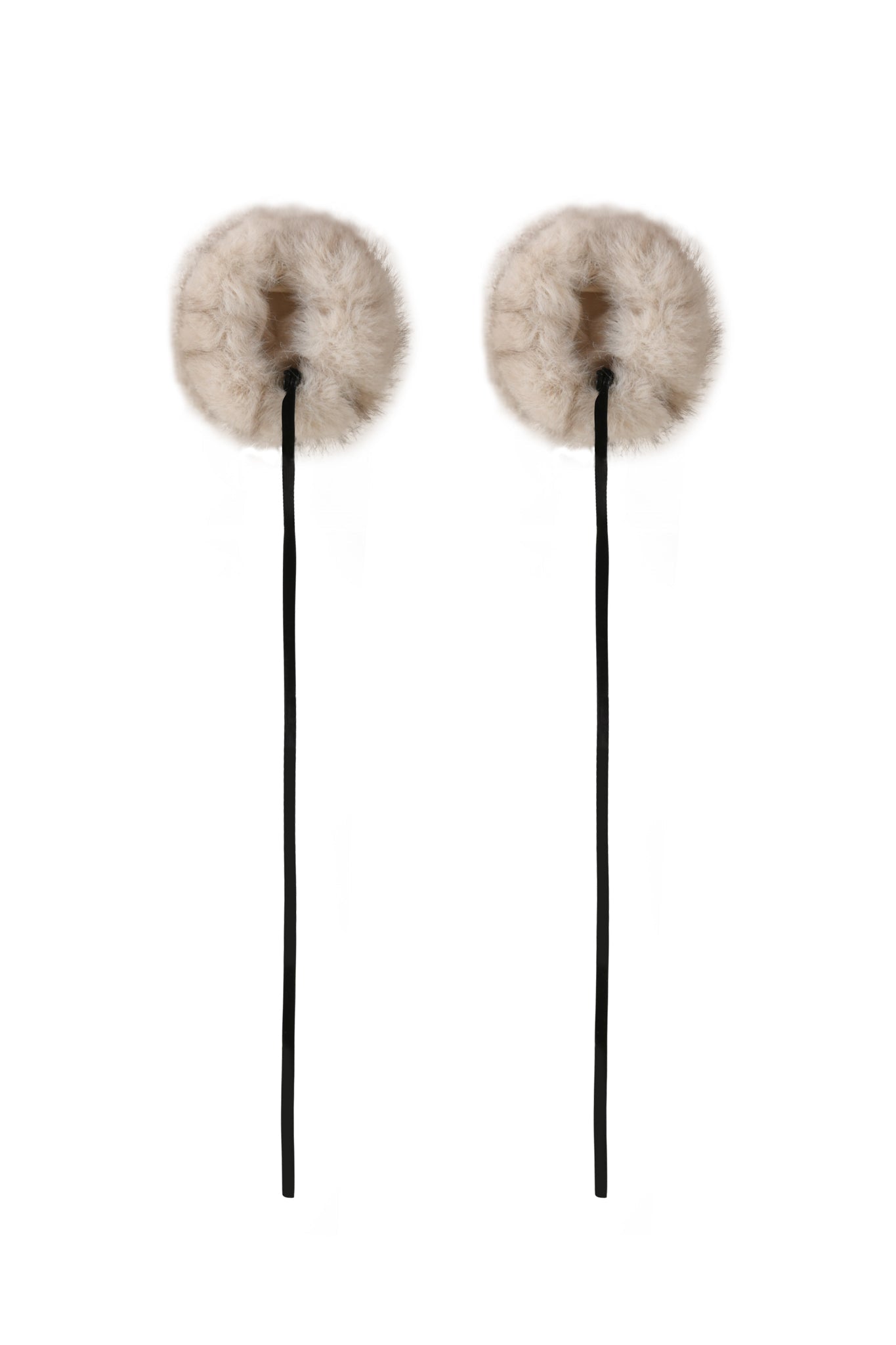 The FAWN HEADPHONE COVERS in Neutral Taupe by I.AM.GIA feature soft, fluffy faux fur pom-poms on long black sticks, shown against a white background.