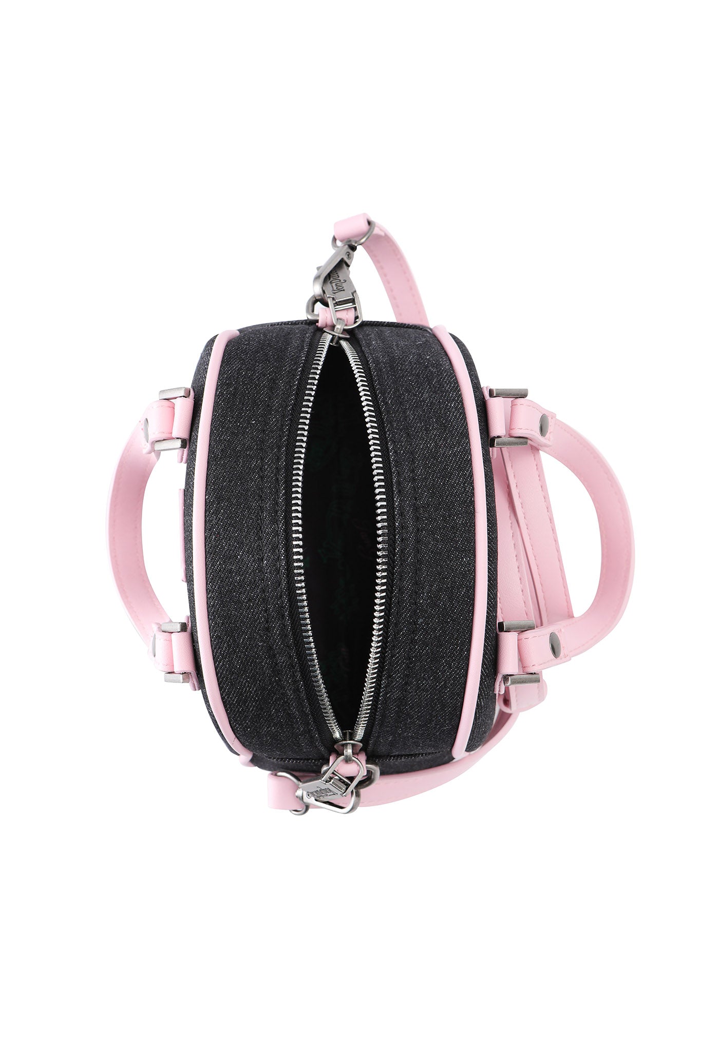 Top view of the I.AM.GIA X VON DUTCH BOWLING BAG in indigo denim, featuring light pink leather handles and trim with a silver zipper partially open, showcasing its chic empty interior.