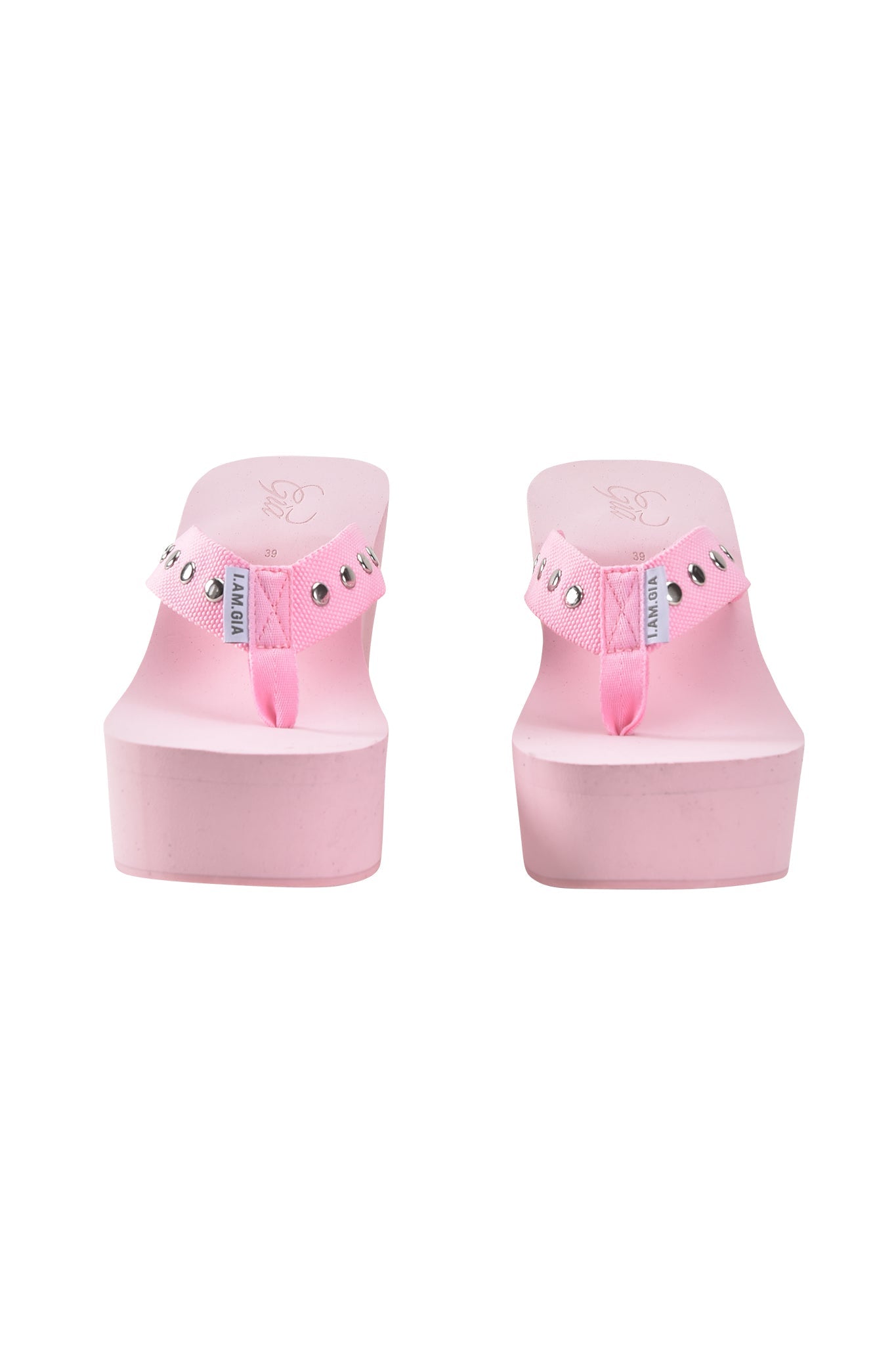 The I.AM.GIA SHELBY STUDDED FLIP FLOP 2.0 in baby pink features rhinestone-studded platform sandals, shown from the front against a white background.