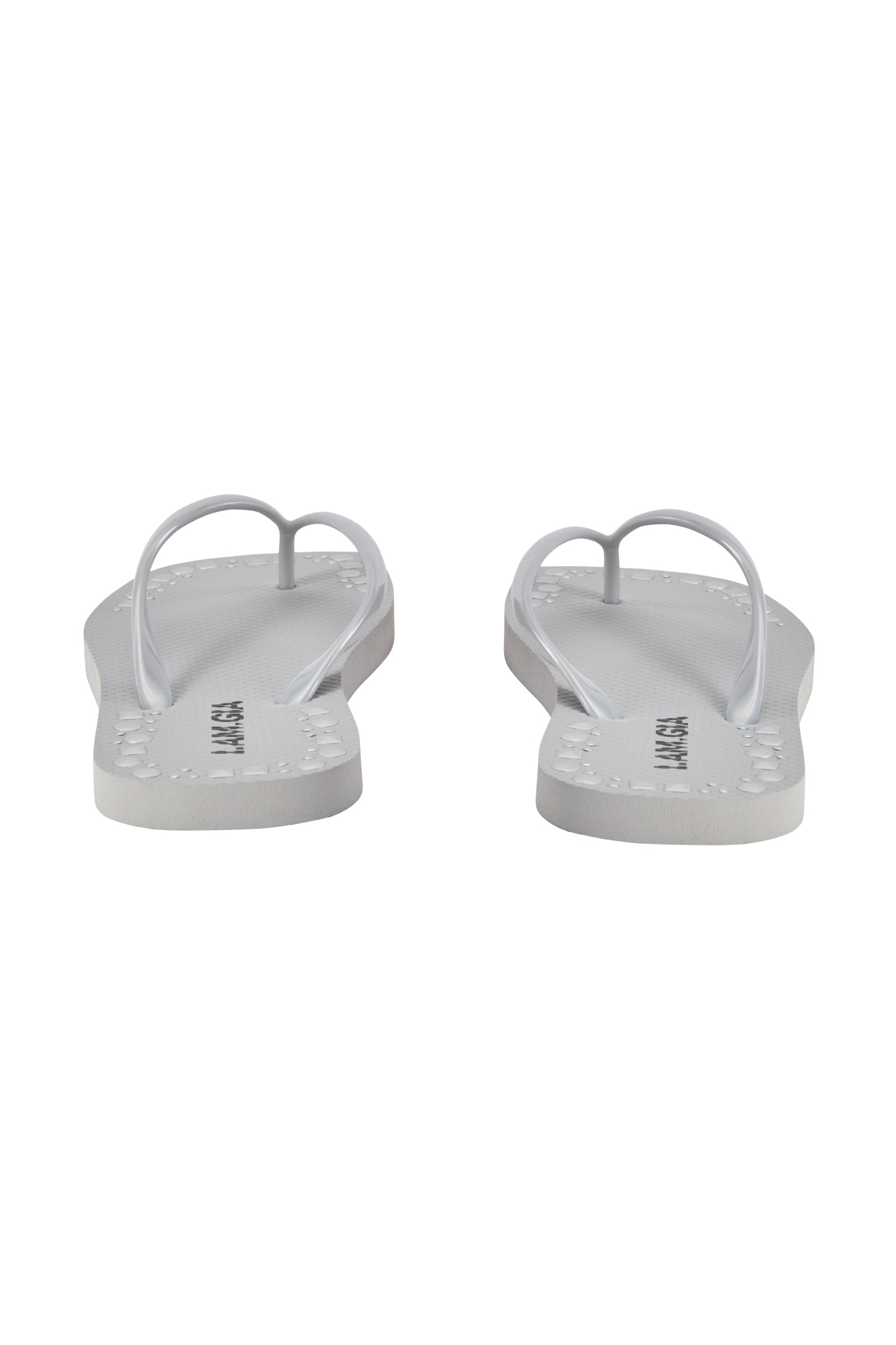 The I.AM.GIA INKA STUDDED FLIP FLOP in silver features a comfortable footbed, simple thong straps, and visible soles, shown from the back on a white background.