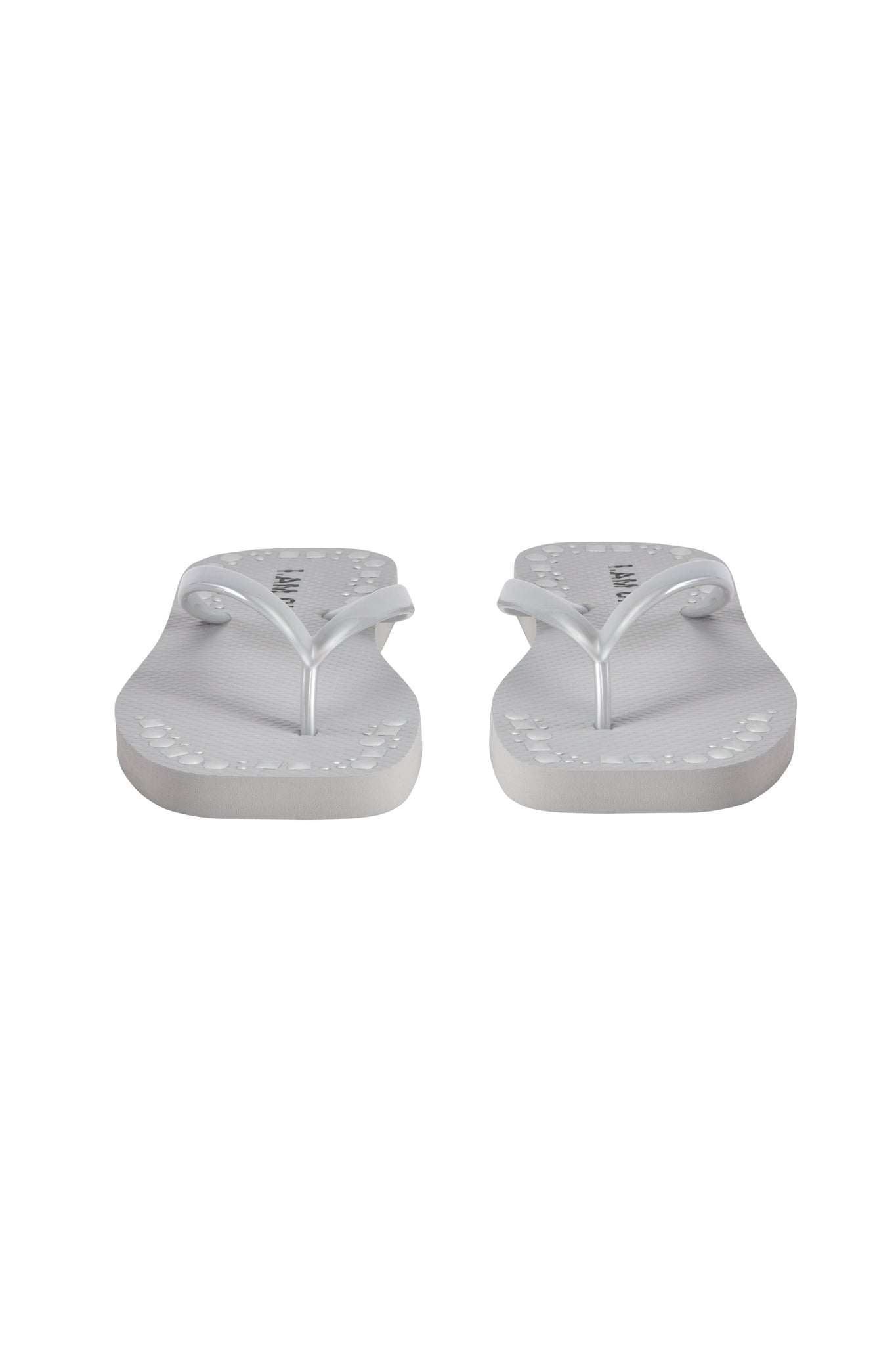 The INKA STUDDED FLIP FLOP - SILVER by I.AM.GIA features white textured straps with silver studs and comfy footbeds, shown from the front on a plain white background.