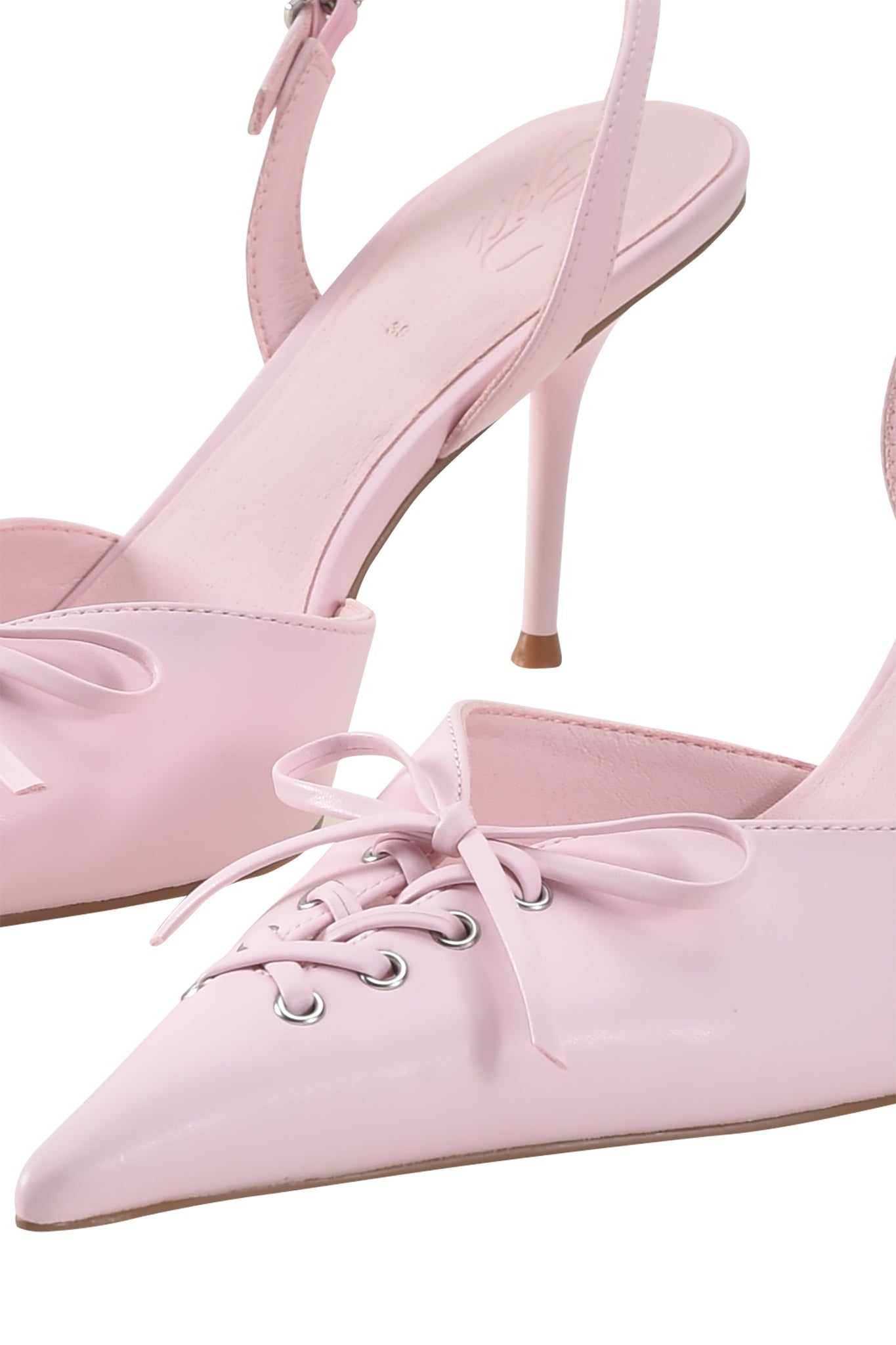 Close-up of I.AM.GIA NOORI MULE – ICE PINK: faux leather pointed toe heels with lace-up front, metal eyelets, slender kitten heel, and stylish slingback strap design.