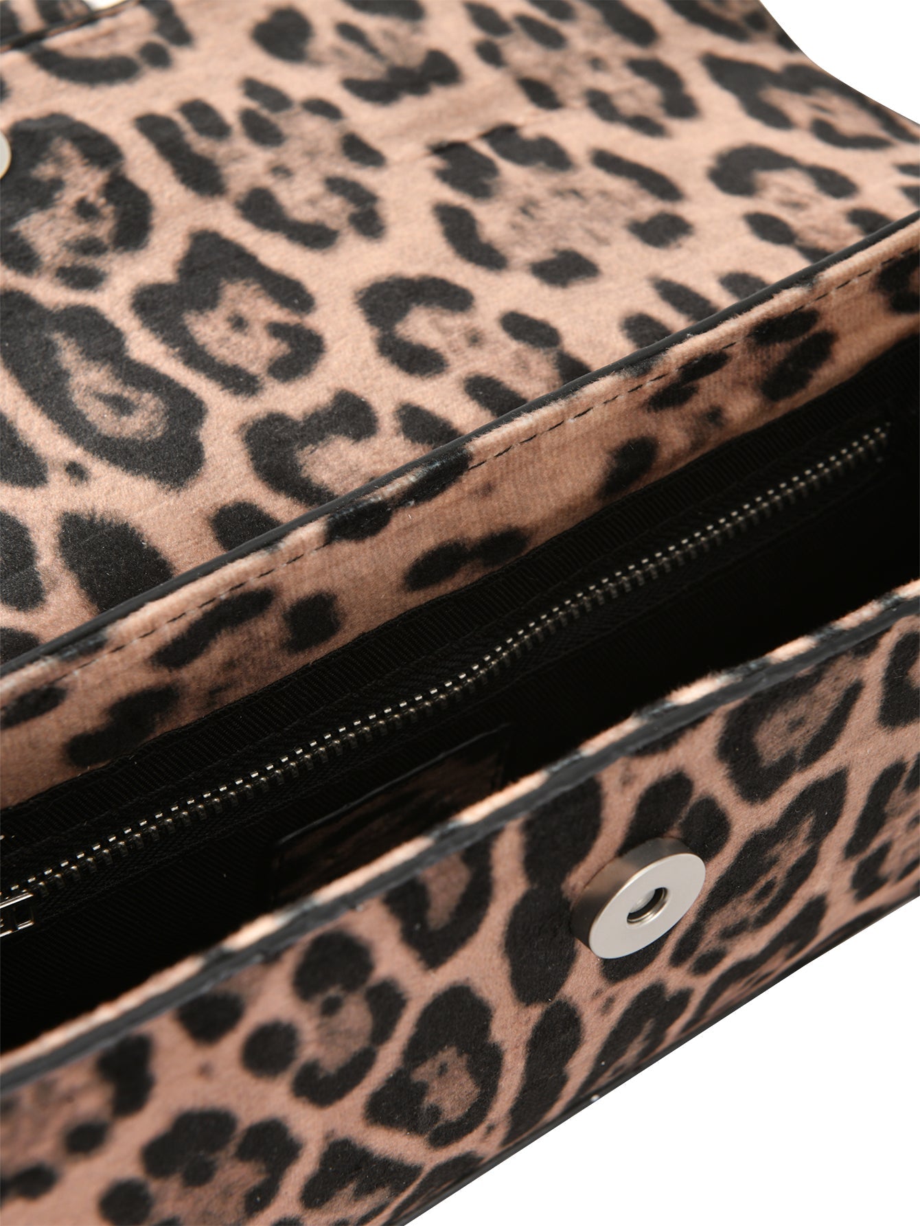 Close-up of an open I.AM.GIA MILA BAG - PANTHERA with a leopard print, magnetic snap closure, and visible interior zippered pocket.