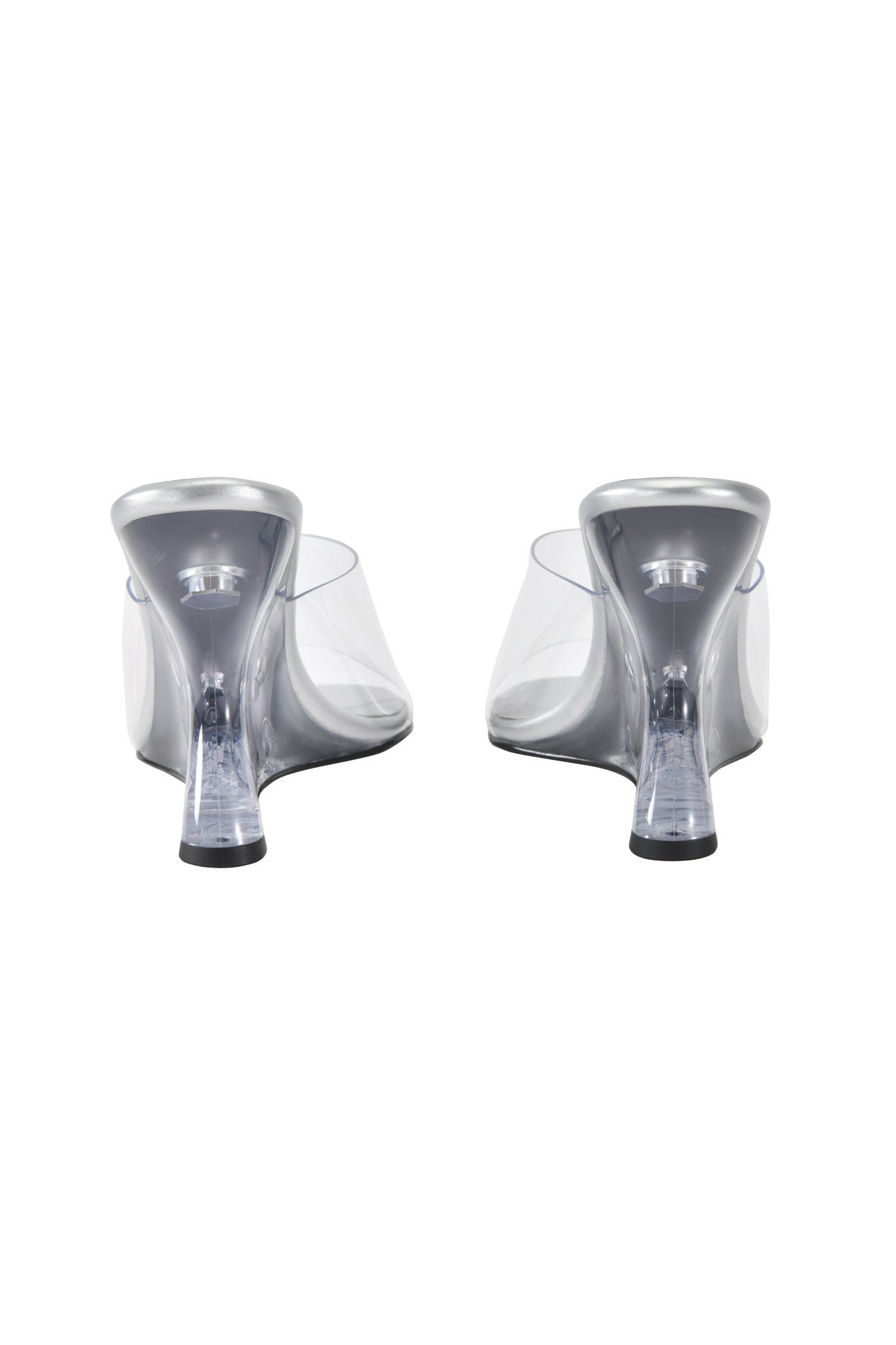 The RHEA CLEAR WEDGE HEEL - TRANSPARENT by I.AM.GIA features a mule silhouette with clear vinyl straps and an open back, shown from the rear on a white background.