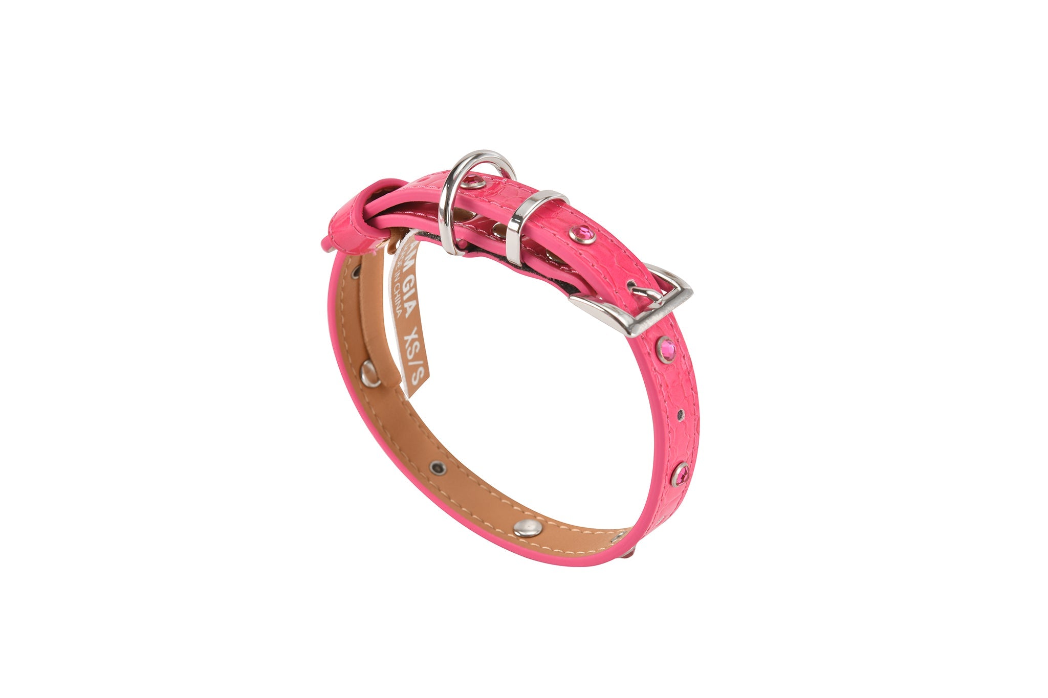 The STAR PET COLLAR - HOT PINK by I.AM.GIA is a chic pink faux leather collar with silver studs, a metal buckle, and crocodile texture, shown on a white background.