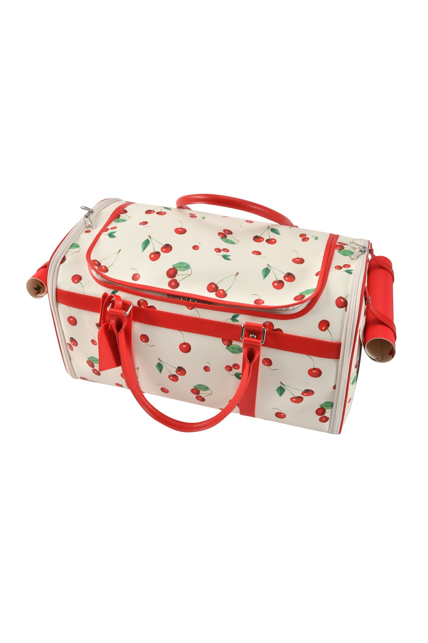 The I.AM.GIA TRIXX PET CARRIER - CHERRY ON TOP is a white duffle with a cherry print, red handles, trim, and a front zip pocket—perfect as a stylish small pet carrier for your furry friend.