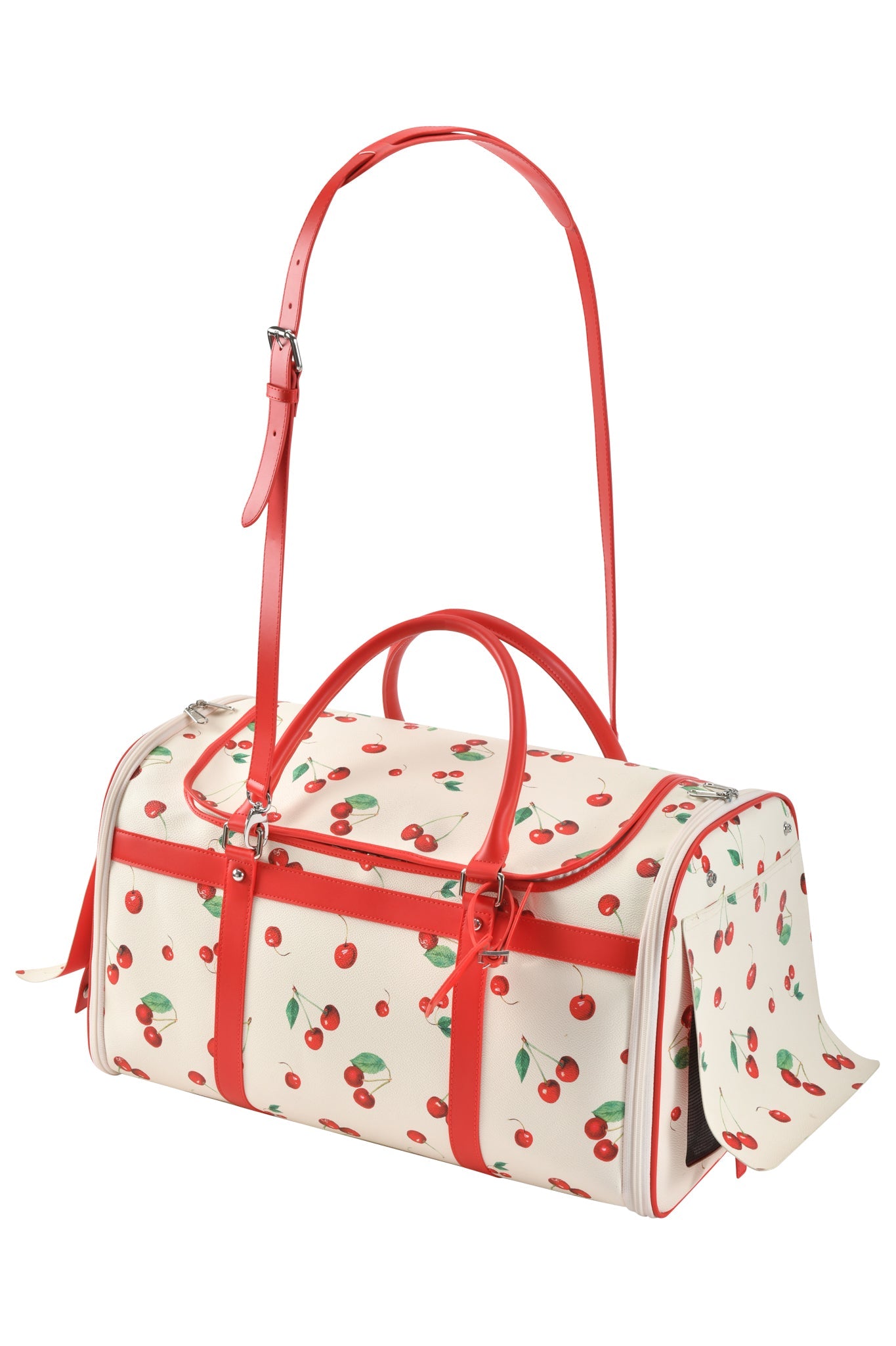 The TRIXX PET CARRIER - CHERRY ON TOP by I.AM.GIA is a cream cherry print dog bag with red accents, red handles, an adjustable shoulder strap, and zippers—combining playful style and practical design for your pet.