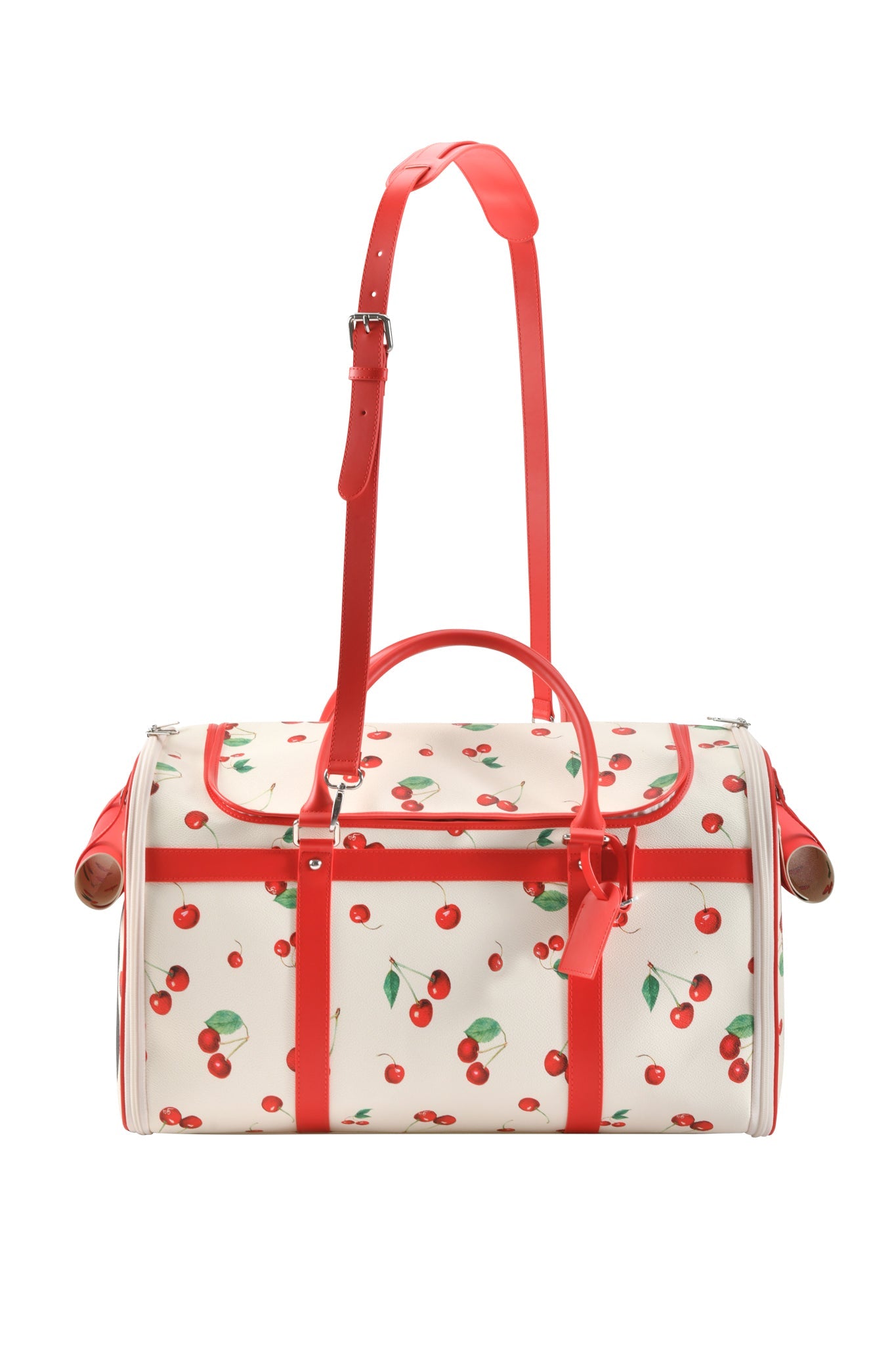 Carry your pet in style with the I.AM.GIA TRIXX PET CARRIER - CHERRY ON TOP, a white bag featuring cherry print, red handles, straps, detachable shoulder strap, and red accents—perfect for your furry friend's comfort!.