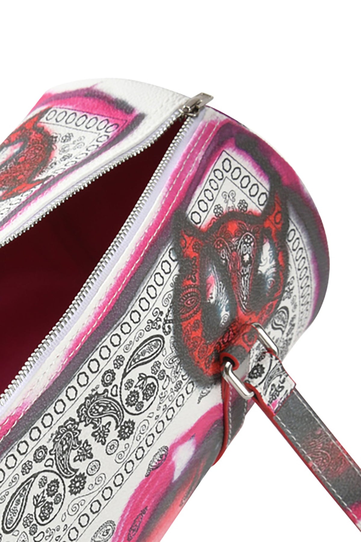 Close-up of the I.AM.GIA T-REX BARREL BAG - PAISLEY FACE, featuring black and pink paisley faux leather, red lining, and a strap with a metal ring attachment.