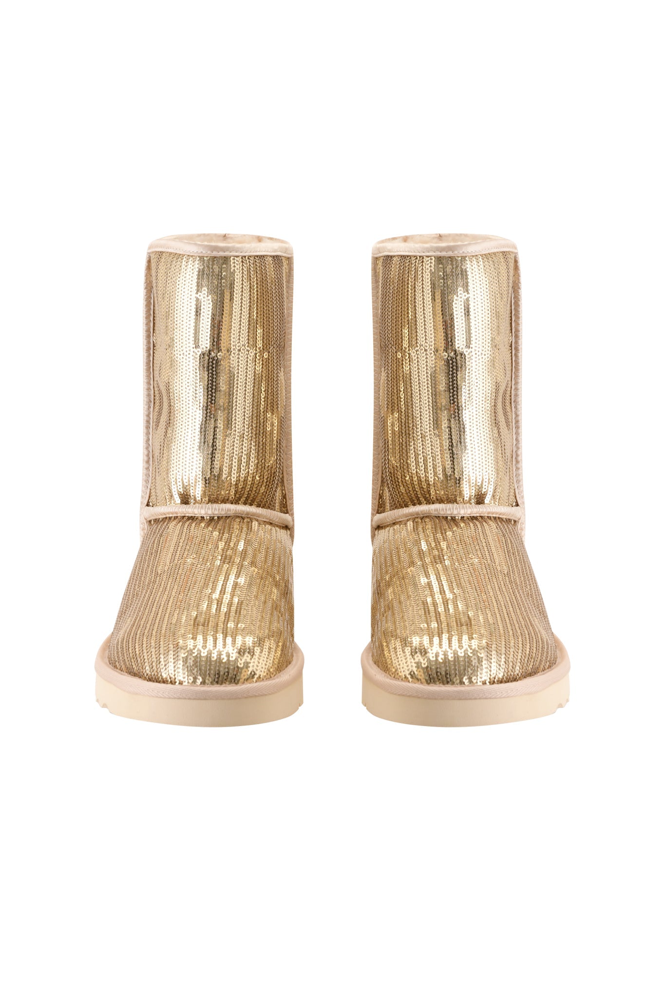 The ELVIRA SEQUIN BOOT - GOLD by I.AM.GIA is a pair of mid-calf gold sequin boots with flat soles and a luxurious faux fur lining, shown from the front against a white background.