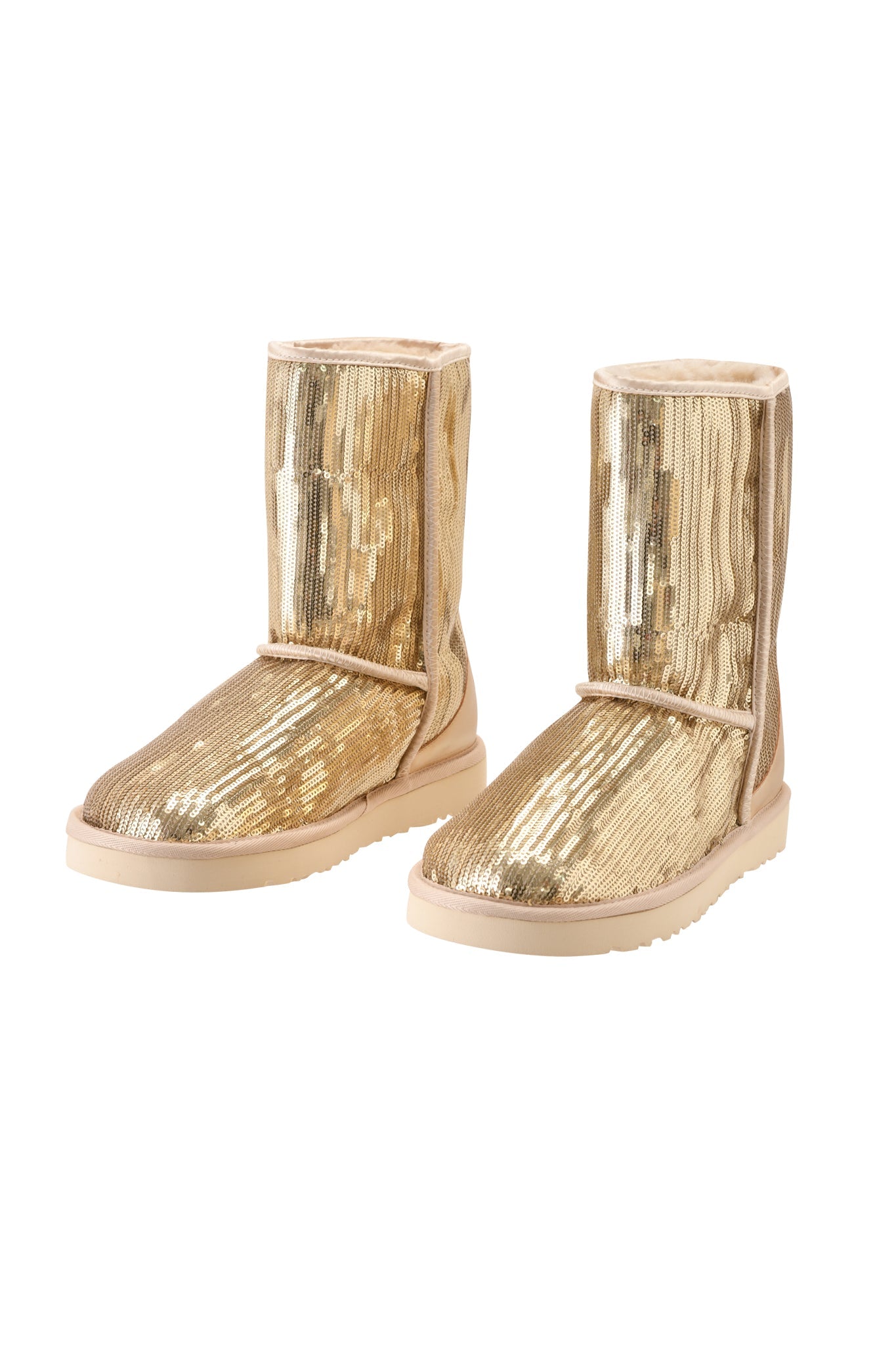 A pair of I.AM.GIA ELVIRA SEQUIN BOOT - GOLD, featuring a mid-calf silhouette adorned with shimmering gold sequins, light-colored soles, and a plush faux fur lining, displayed side by side on a white background.