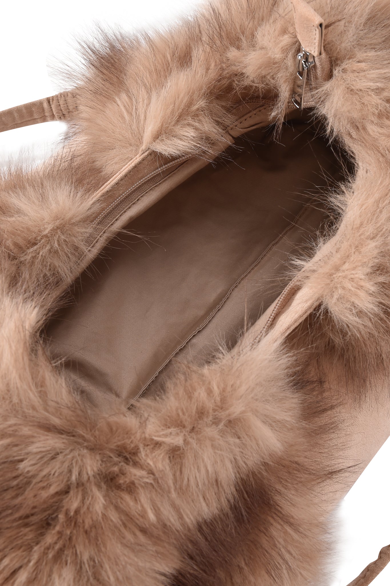 A close-up of the I.AM.GIA GENA FAUX FUR HANDBAG in tan suede shows its soft, fluffy faux fur trim, fabric-lined interior with a zipper pocket on one side, and elegant silver chain straps.