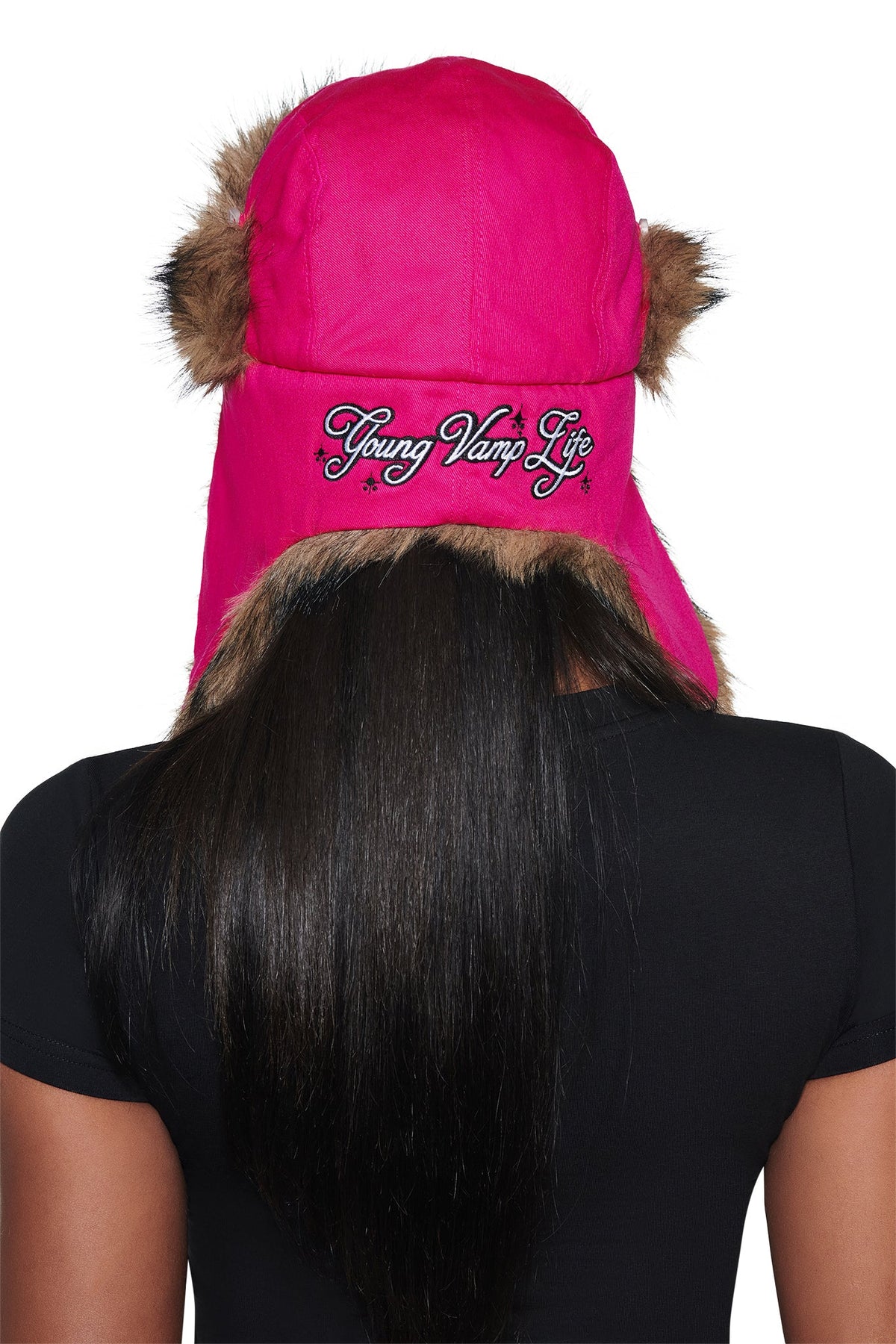 Bright pink I.AM.GIA YVL FUR TRAPPER HAT - PINK faux fur trapper hat featuring the embroidered text “Young Vamp Life” on the back.