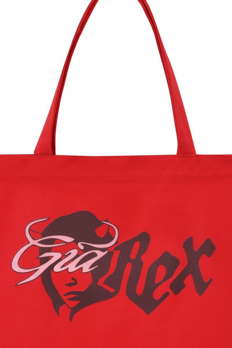 The I.AM.GIA T-REX TOTE BAG - RED features bold “Gal Rex” text and devil girl artwork, making it a standout canvas laptop tote for everyday style.
