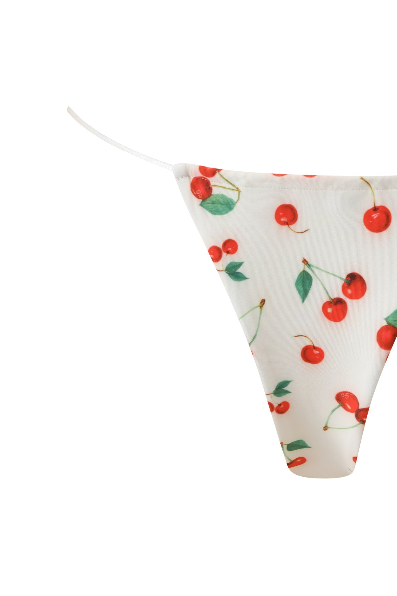 The I.AM.GIA BAMBI BIKINI BOTTOM - CHERRY ON TOP features a white thong design with red cherry and green leaf print, thin side straps, and is displayed on a plain white background.