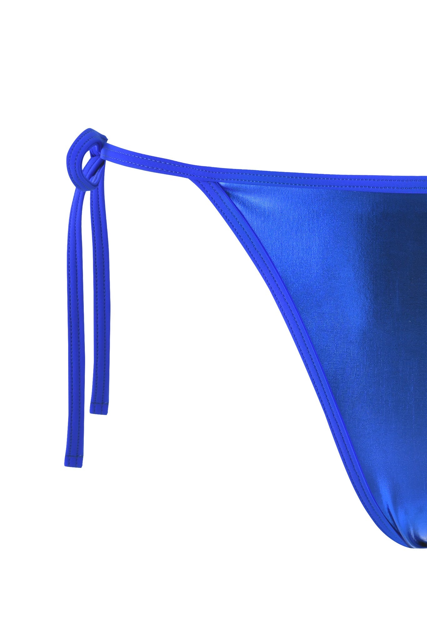 Close-up of the ALOHI BIKINI BOTTOM - BLUE : COBALT BLUE from I.AM.GIA. The swimsuit fabric is shiny, featuring a thin side tie on the left that forms a small bow. The texture and material reflect light, showcasing the glossy finish. The bikini bottom is partially cropped in the image.