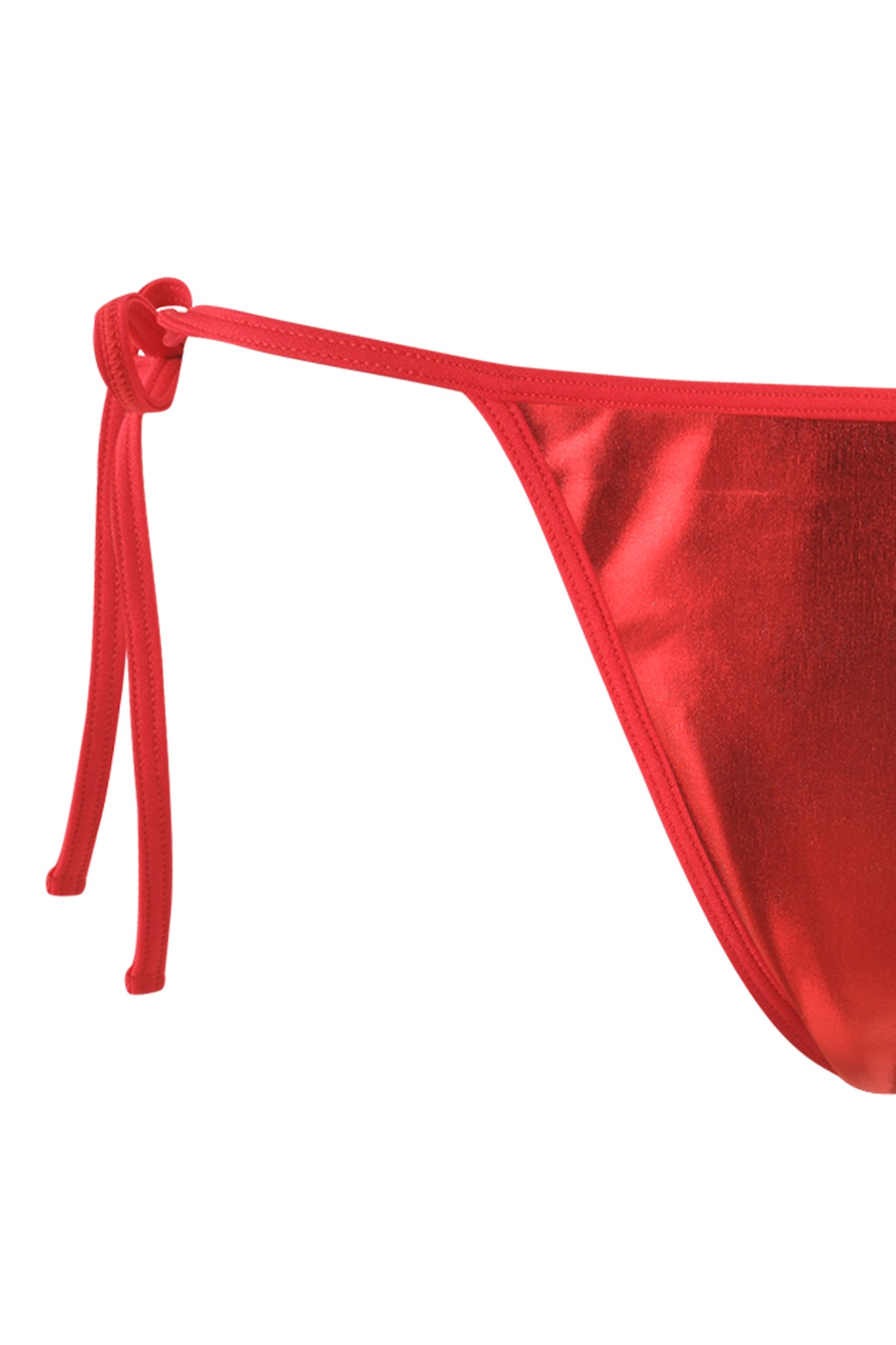 Close-up of the side tie of the ALOHI BIKINI BOTTOM - RED by I.AM.GIA. The tie features a simple knot and the fabric has a metallic sheen. The bright color and smooth texture make this swimwear standout.