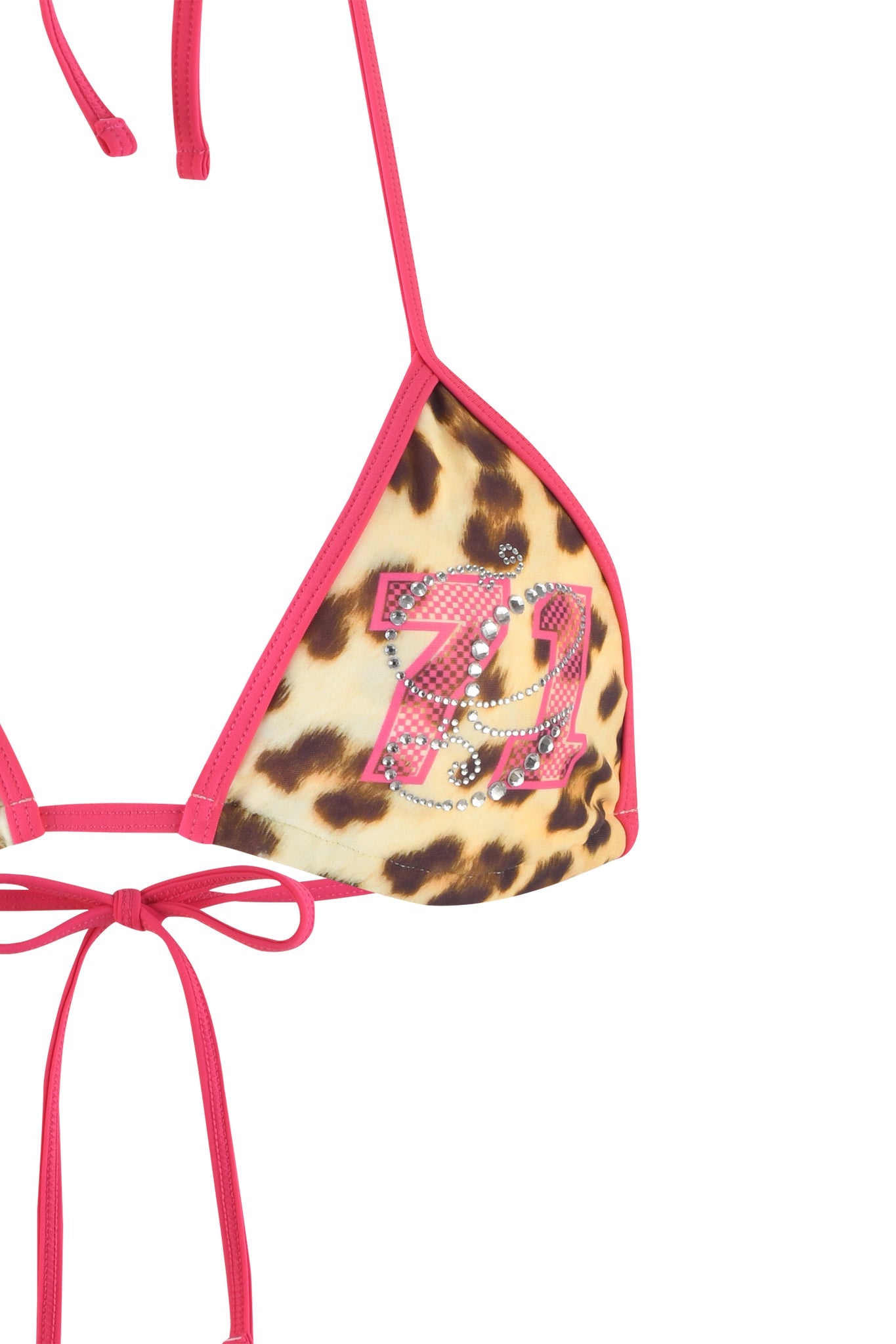 A close-up of the CORDELIA BIKINI TOP - NEUTRAL : LEOPARD : WILDCARD from I.AM.GIA showcases its leopard print fabric accented with vibrant pink trim. The left triangle cup is embellished with the number "77" in rhinestones. Pink strings tie the top together at the back and neck.