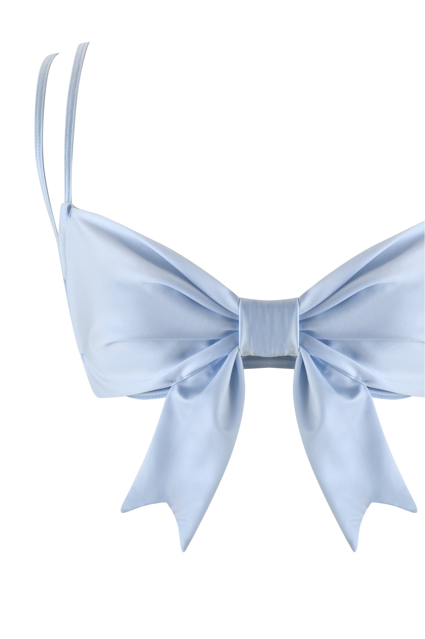 The DELPHINA BIKINI TOP - BLUE : BABY BLUE by I.AM.GIA is a pale blue bralette that features a large bow at the front and has thin adjustable straps. Its simple elegance is accentuated by the shiny satin swim knit fabric.