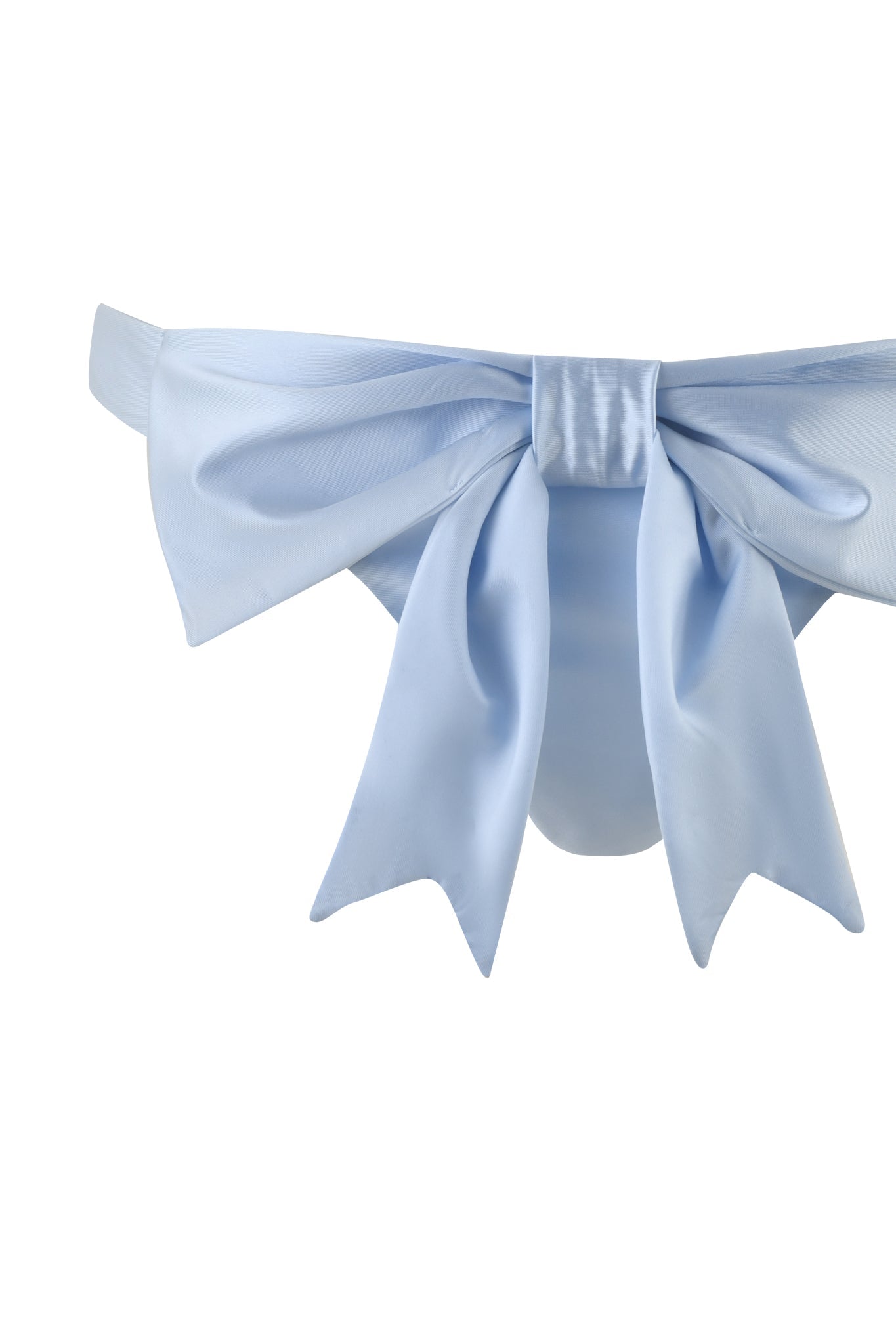 The DELPHINA BIKINI BOTTOM - BLUE in baby blue by I.AM.GIA features an oversized bow at the back, providing a playful yet sophisticated touch. With cheeky back coverage, they beautifully display fashion design against a crisp white backdrop.