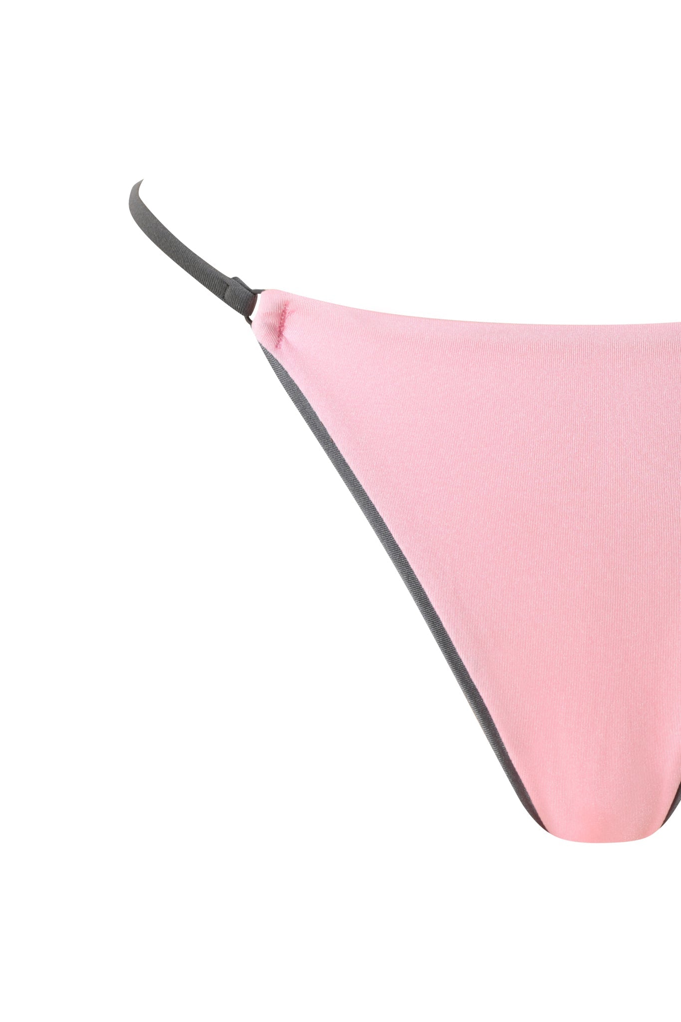 A close-up of the I.AM.GIA CAMERON BIKINI BOTTOM in baby pink, featuring dark gray straps and a thong back, displayed against a white background.